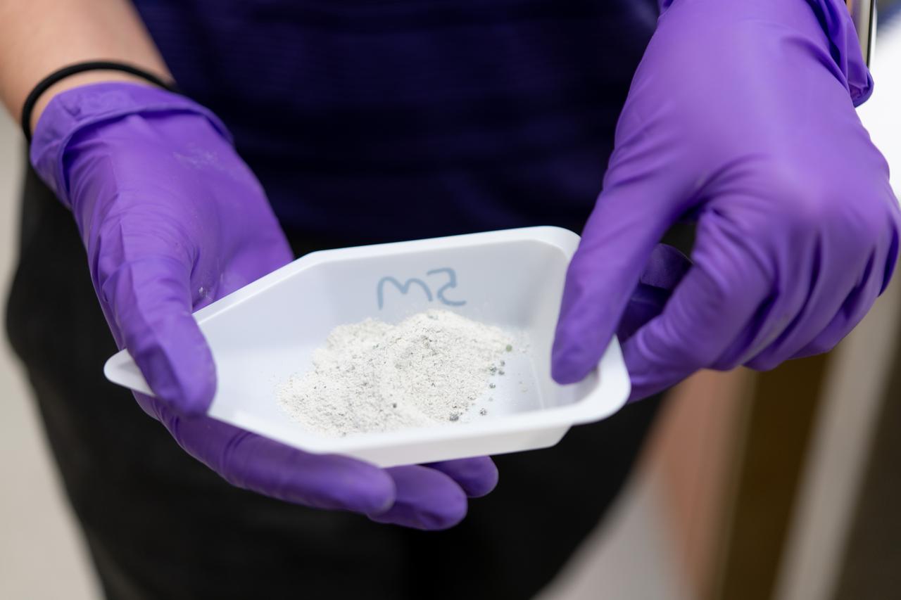 Sylvie Crowell who works in the Environmental Effects and Coatings Branch at NASA Glenn Research Center performs ball milling and particle size analysis on some lunar dust simulant on January 29, 2025. 