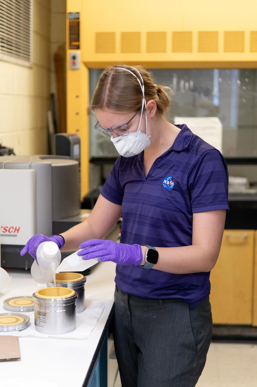 Sylvie Crowell who works in the Environmental Effects and Coatings Branch at NASA Glenn Research Center performs ball milling and particle size analysis on some lunar dust simulant on January 29, 2025.
