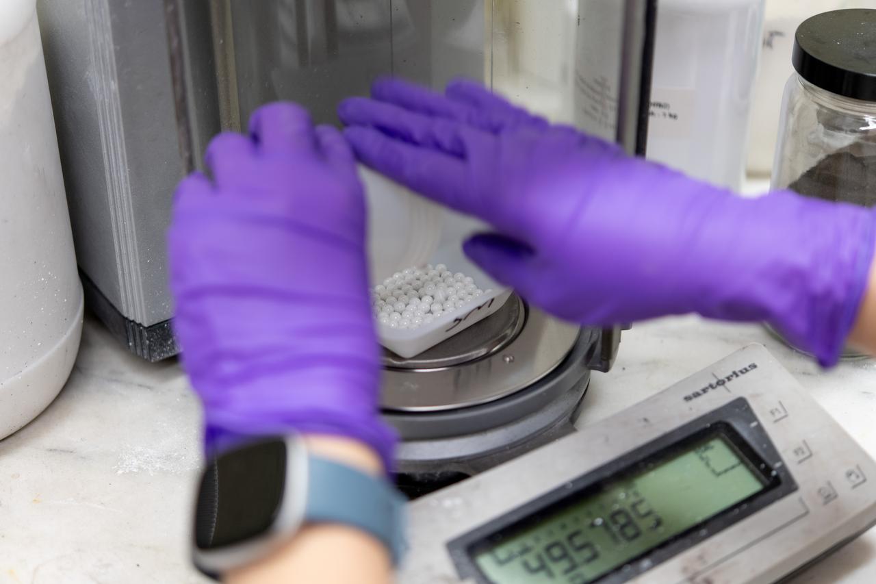 Sylvie Crowell who works in the Environmental Effects and Coatings Branch at NASA Glenn Research Center performs ball milling and particle size analysis on some lunar dust simulant on January 29, 2025. 