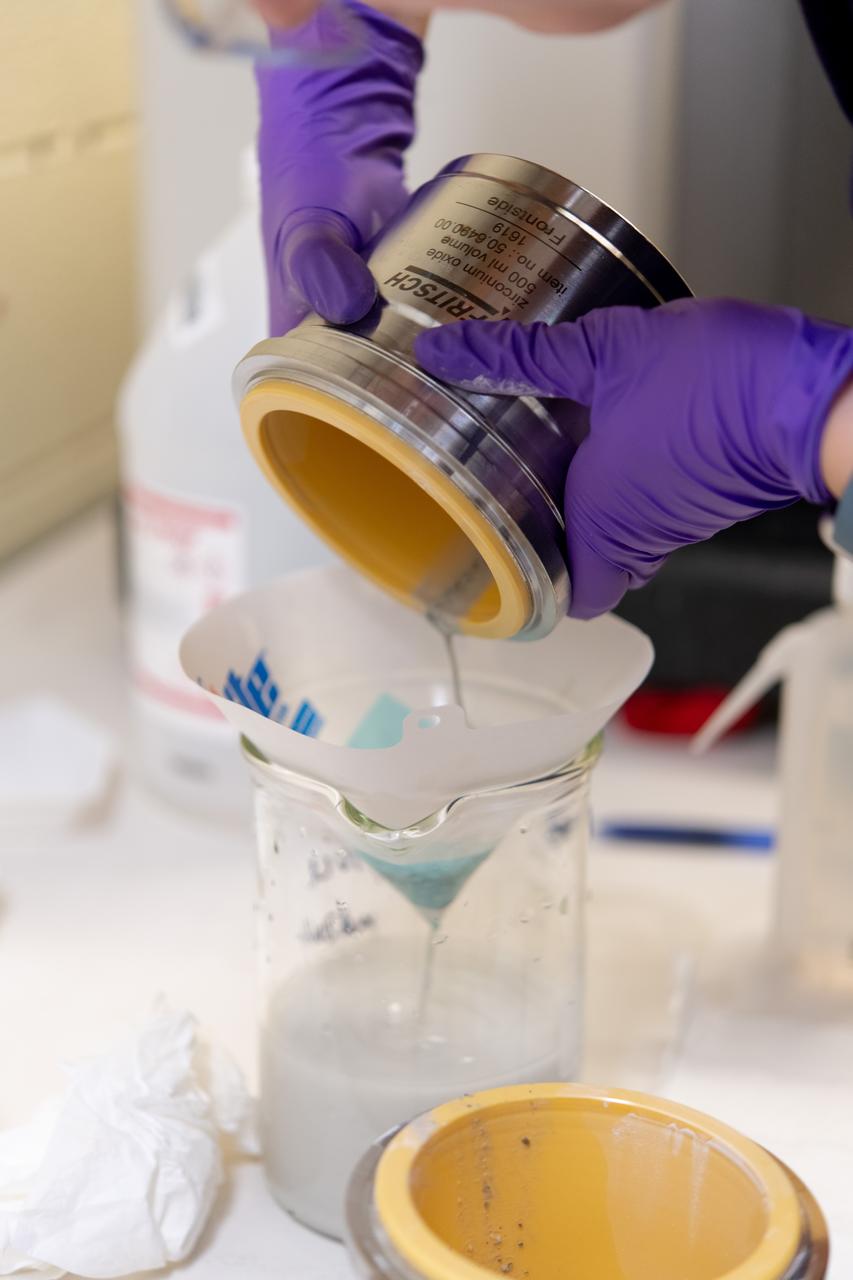 Sylvie Crowell who works in the Environmental Effects and Coatings Branch at NASA Glenn Research Center performs ball milling and particle size analysis on some lunar dust simulant on January 29, 2025. 