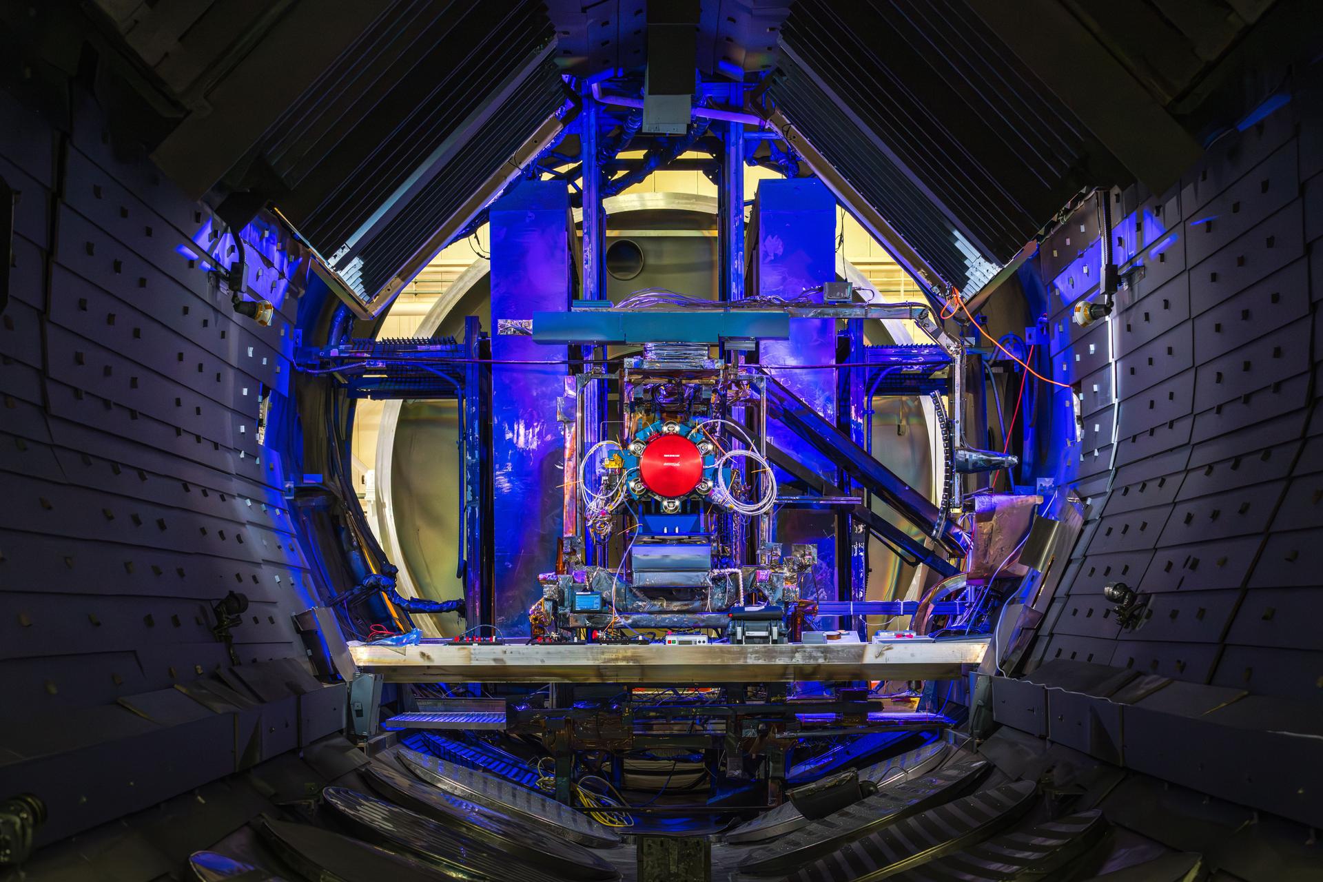 Advanced Electric Propulsion System (AEPS) thruster positioned in a vacuum chamber at NASA's Glenn Research Center.