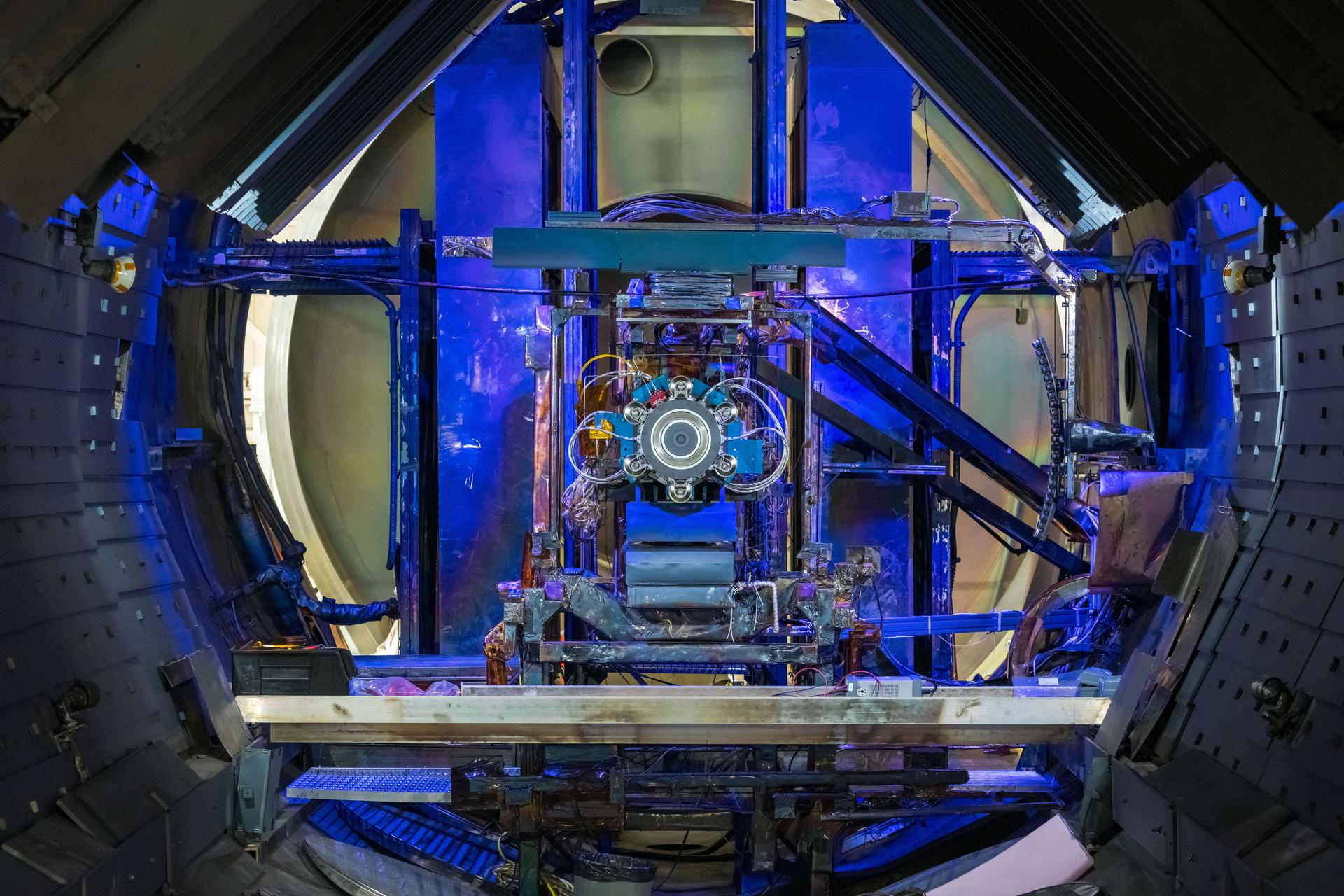 Advanced Electric Propulsion System (AEPS) thruster positioned in a vacuum chamber at NASA's Glenn Research Center.