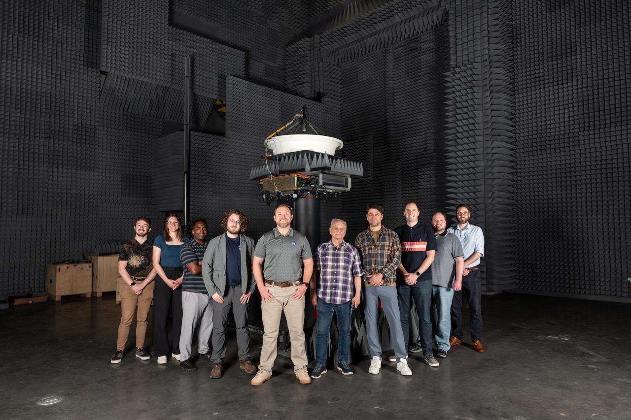 NASA’s Beaming Energy for Air Mobility team successfully completed a first-of-its-kind power beaming test at NASA Glenn on June 4, 2025. Later this year, the tested transmitter will be used in a demonstration to wirelessly transmit power using microwaves to a custom power receiver — a step toward gap-filling technology that could one day deliver power on the surface of the Moon or Mars.  Pictured from left to right are Hayden Klopp, Rebecca Buehrle, Kerry Johnson, Avery Brock, Seth Schisler, Vladimir Volman, Seth Waldstein, David Rinehart, Rocco Viggiano,  and Donald Dornbusch. 