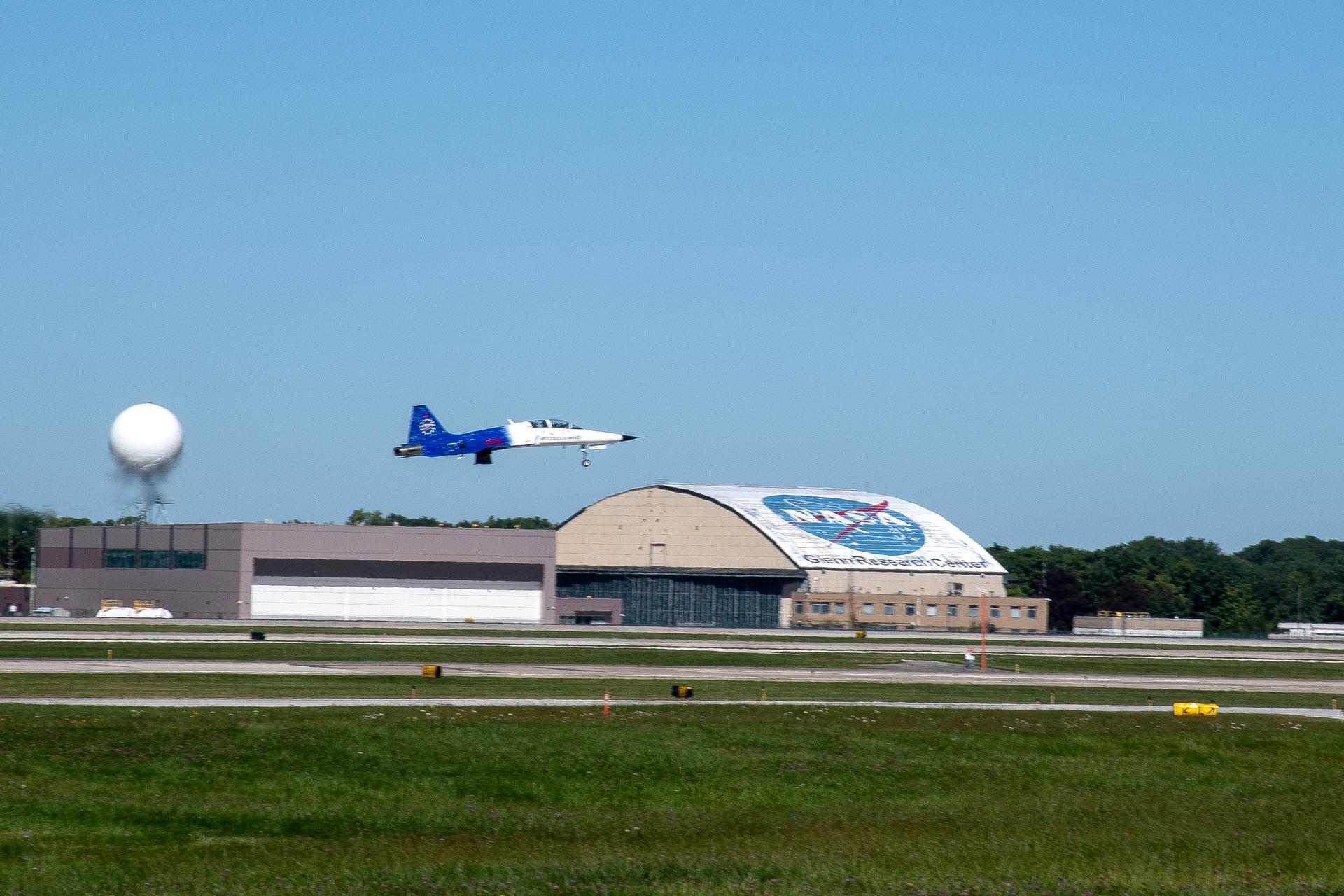 NASA Administrator Jared Isaacman and two GRC employees’ riders fly over the Cleveland Browns football game start.  One of the jets takes off from Cleveland Hopkins Airport and flies past the GRC hangar.