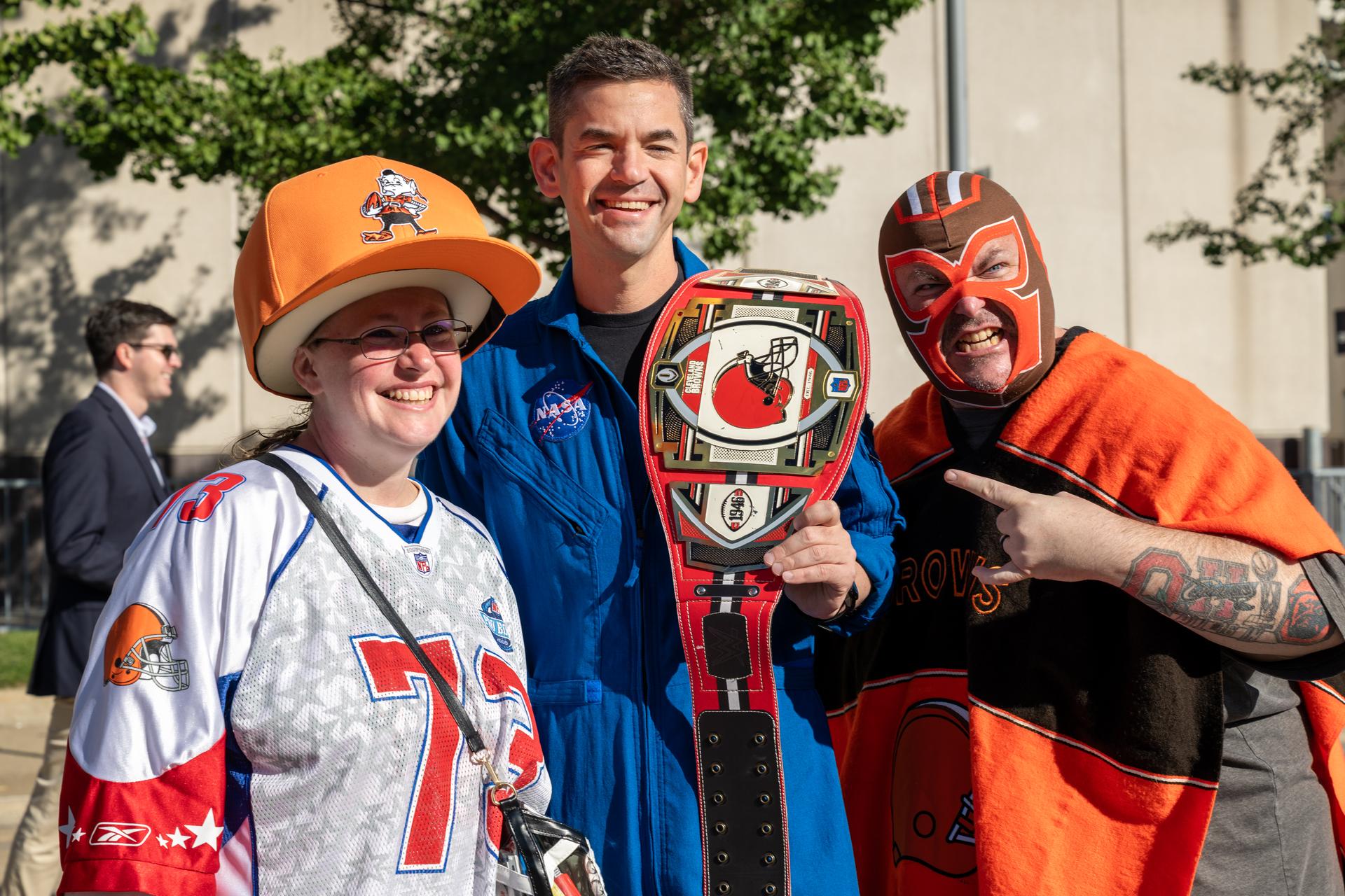 NASA Administrator Jared Isaacman poses with Browns' fans at an NFL game between the Cleveland Browns and the Carolina Panthers at Huntington Bank Field, Sunday, September 27th, 2026, in Cleveland, Ohio. NASA’s engagement at NFL games is part of the agency’s Inspiration Tour, aimed at strengthening connections between NASA and its partners and showcasing innovation in air and space in the lead up to the MAX POWER aerospace technology expo and airshow at the agency’s Kennedy Space Center in early November. Photo Credit: (NASA/Jordan Cochran)