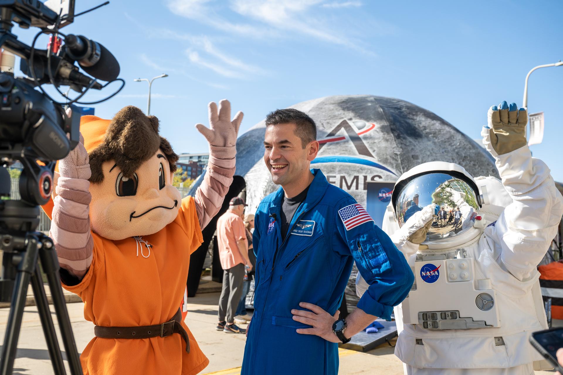 NASA Administrator Jared Isaacman during an interview with Cleveland Browns’ mascot, Brownie the Elf, and Eva the Astronaut at an NFL game between the Cleveland Browns and the Carolina Panthers at Huntington Bank Field, Sunday, September 27th, 2026, in Cleveland, Ohio. NASA’s engagement at NFL games is part of the agency’s Inspiration Tour, aimed at strengthening connections between NASA and its partners and showcasing innovation in air and space in the lead up to the MAX POWER aerospace technology expo and airshow at the agency’s Kennedy Space Center in early November. Photo Credit: (NASA/Jordan Cochran)