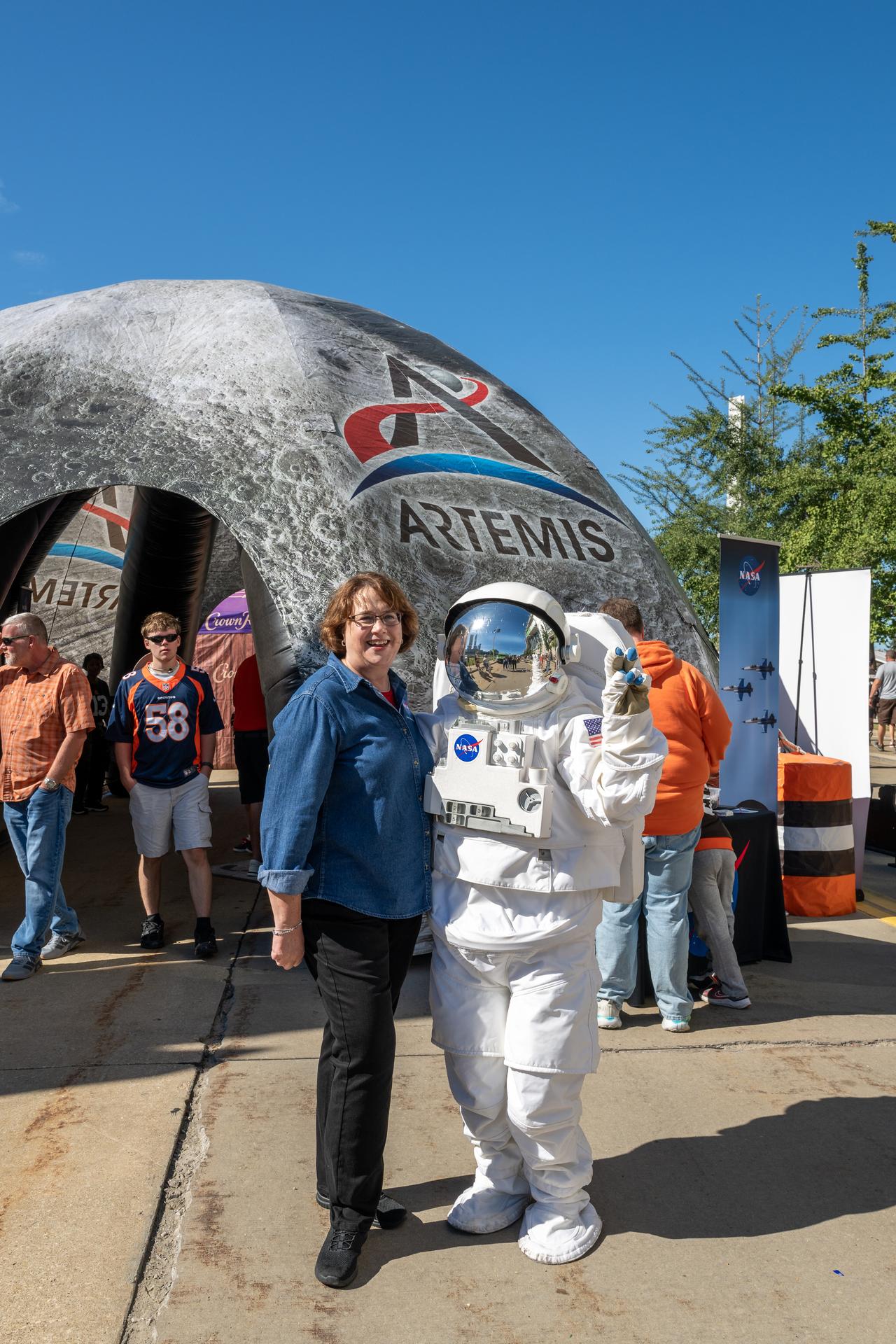 GRC Center Director Dawn Schaible poses with Eva the Astronaut at an NFL game between the Cleveland Browns and the Carolina Panthers at Huntington Bank Field, Sunday, September 27th, 2026, in Cleveland, Ohio. NASA’s engagement at NFL games is part of the agency’s Inspiration Tour, aimed at strengthening connections between NASA and its partners and showcasing innovation in air and space in the lead up to the MAX POWER aerospace technology expo and airshow at the agency’s Kennedy Space Center in early November. Photo Credit: (NASA/Jordan Cochran)