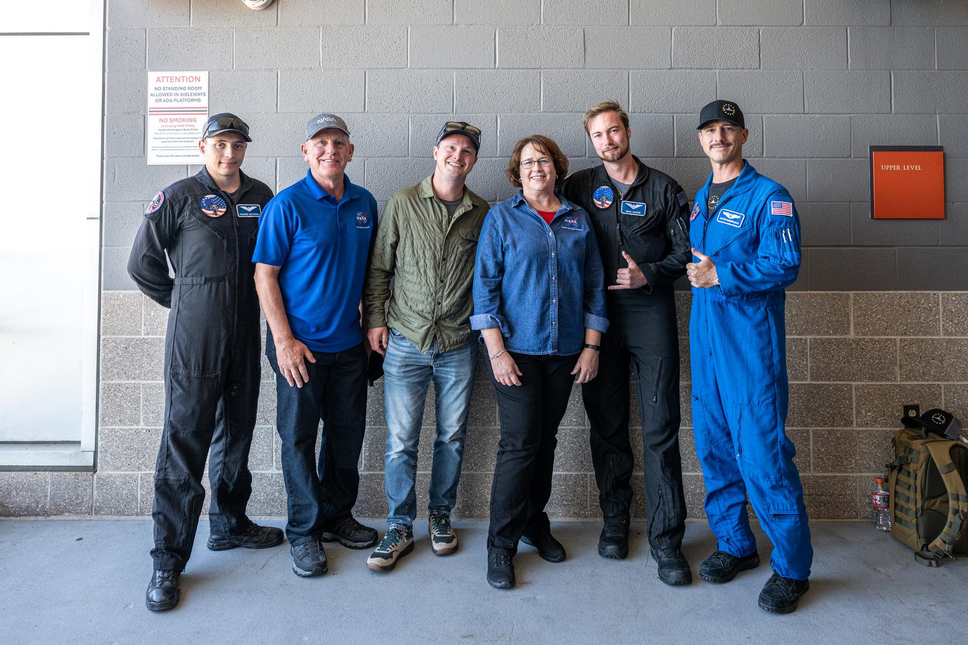 GRC Associate Director Laurence Sivic and GRC Center Director Dawn Schaible pose with members of the Freedom 250 F-5 team at an NFL game between the Cleveland Browns and the Carolina Panthers at Huntington Bank Field, Sunday, September 27th, 2026, in Cleveland, Ohio. NASA’s engagement at NFL games is part of the agency’s Inspiration Tour, aimed at strengthening connections between NASA and its partners and showcasing innovation in air and space in the lead up to the MAX POWER aerospace technology expo and airshow at the agency’s Kennedy Space Center in early November. Photo Credit: (NASA/Jordan Cochran)