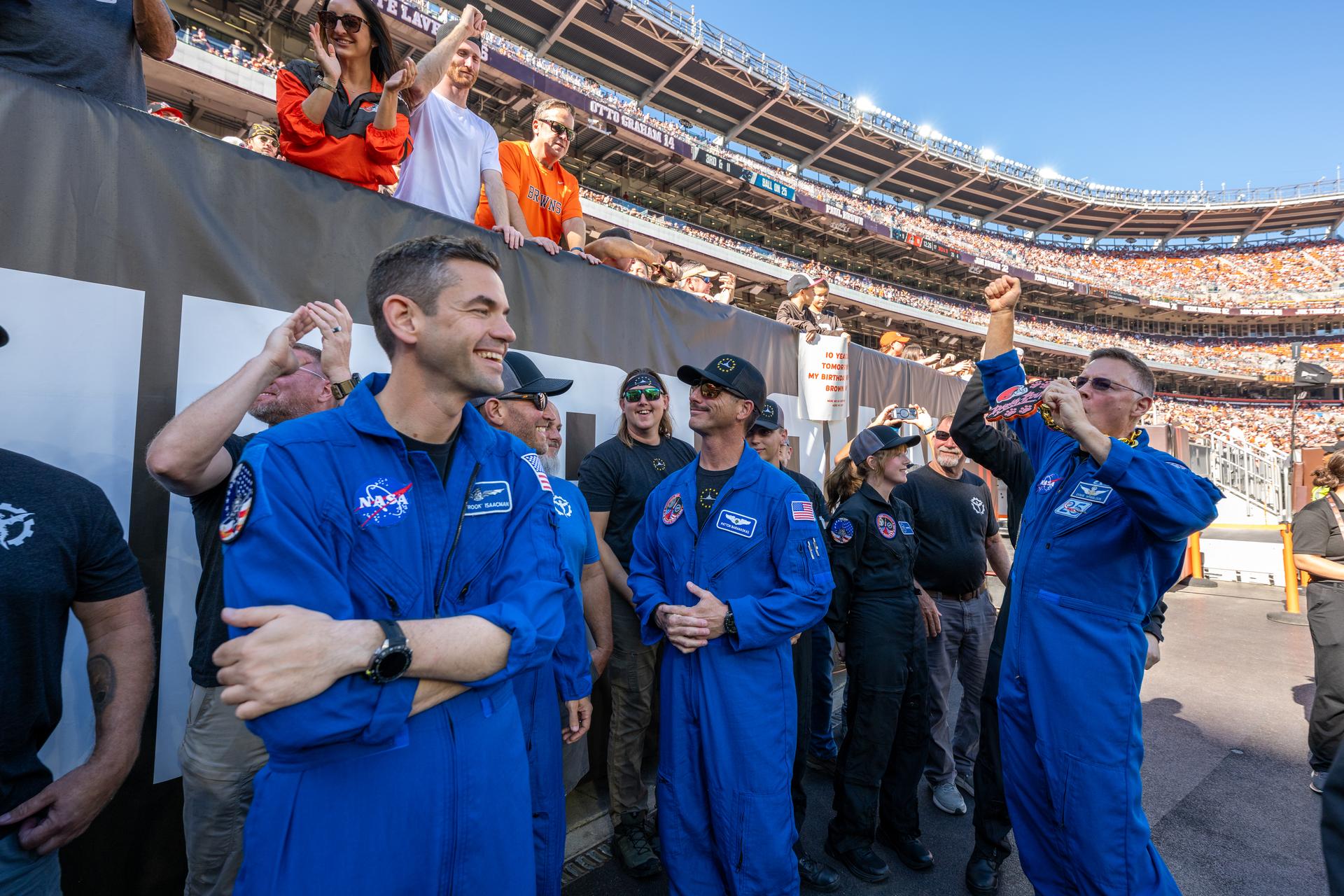 NASA Administrator Jared Isaacman and NASA Astronaut Douglas Wheelock cheer on with fans at an NFL game between the Cleveland Browns and the Carolina Panthers at Huntington Bank Field, Sunday, September 27th, 2026, in Cleveland, Ohio. NASA’s engagement at NFL games is part of the agency’s Inspiration Tour, aimed at strengthening connections between NASA and its partners and showcasing innovation in air and space in the lead up to the MAX POWER aerospace technology expo and airshow at the agency’s Kennedy Space Center in early November. Photo Credit: (NASA/Jordan Cochran)