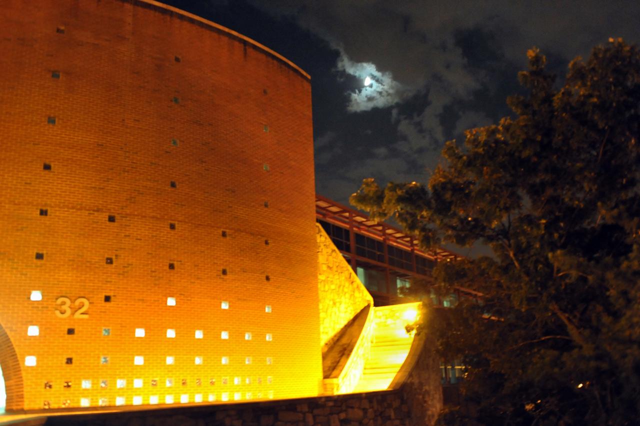 Moon peeks from clouds during a tour of Bldg 32.