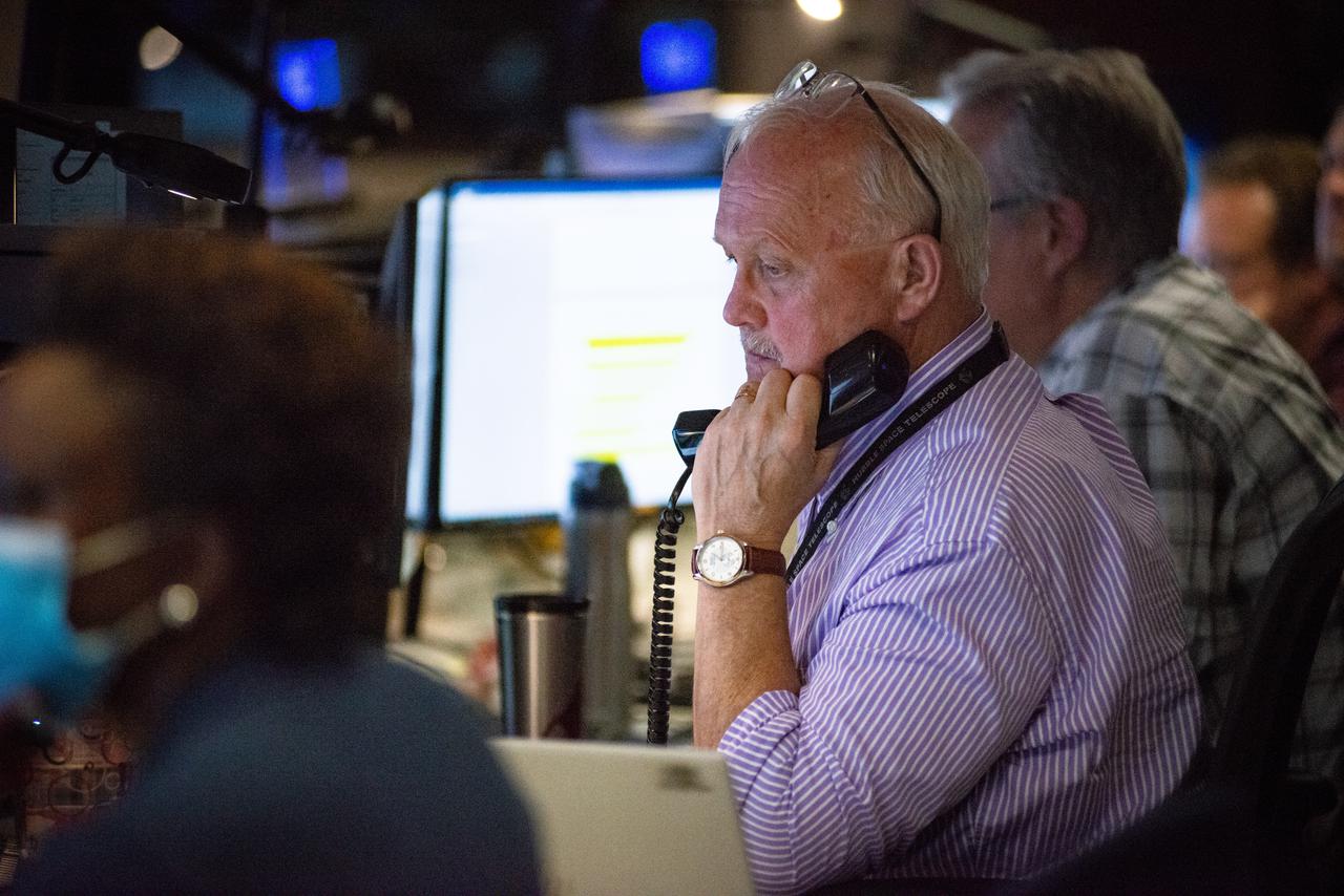 Members of the Hubble operations team work in the control room on July 15, 2021 to restore Hubble to science operations.  Credits: NASA/Goddard/Rebecca Roth  ---  More info: Hubble’s payload computer, which controls and coordinates the observatory’s onboard science instruments, halted suddenly on June 13. When the main computer failed to receive a signal from the payload computer, it automatically placed Hubble’s science instruments into safe mode. That meant the telescope would no longer be doing science while mission specialists analyzed the situation.  In response to the anomaly, NASA began a switch to backup spacecraft hardware on Hubble in response to an ongoing problem with its payload computer. This was a multi-day event.  Science observations restarted the afternoon of Saturday, July 17.  