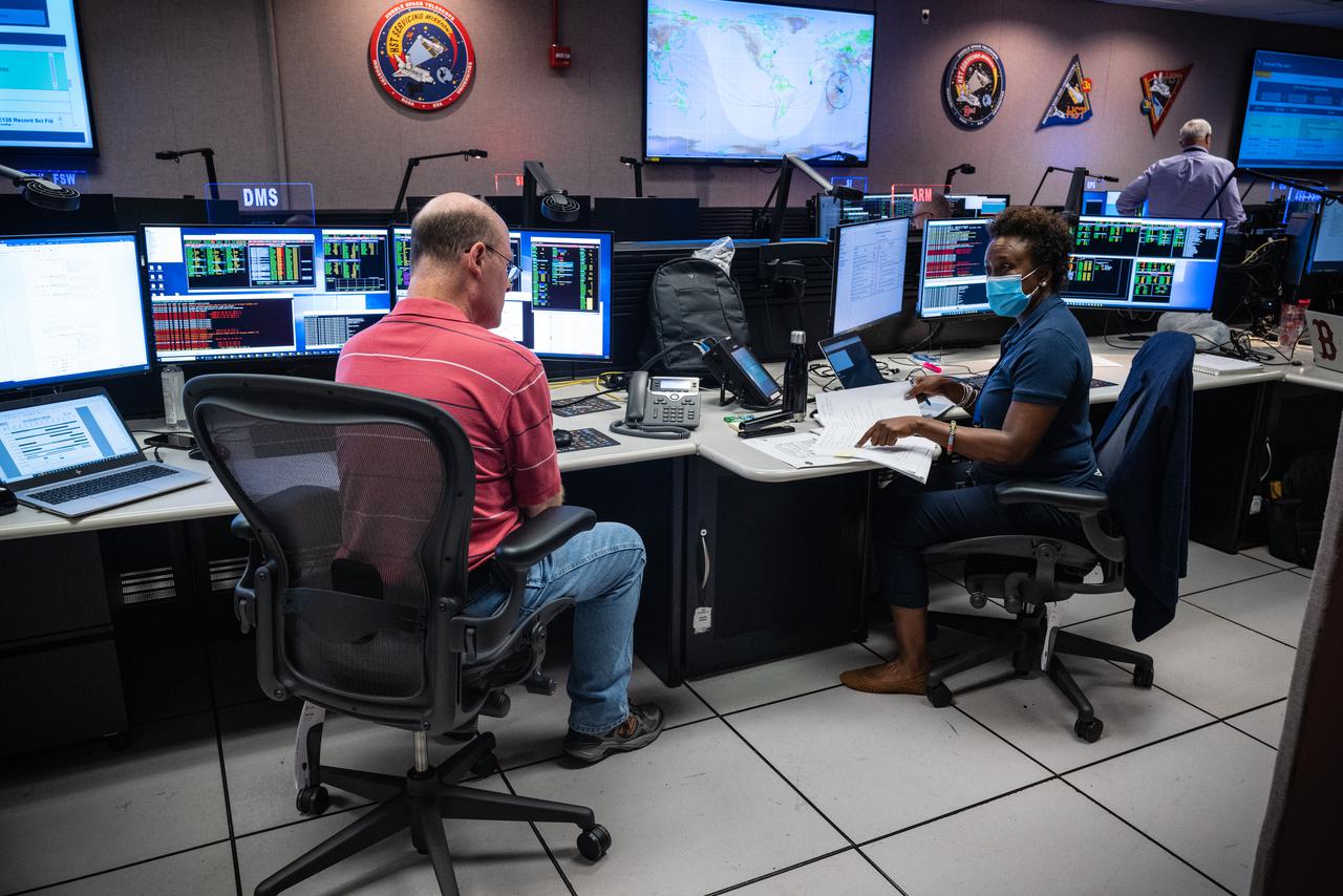 Members of the Hubble operations team work in the control room on July 15, 2021 to restore Hubble to science operations.  Credits: NASA/Goddard/Rebecca Roth ---  More info: Hubble’s payload computer, which controls and coordinates the observatory’s onboard science instruments, halted suddenly on June 13. When the main computer failed to receive a signal from the payload computer, it automatically placed Hubble’s science instruments into safe mode. That meant the telescope would no longer be doing science while mission specialists analyzed the situation.  In response to the anomaly, NASA began a switch to backup spacecraft hardware on Hubble in response to an ongoing problem with its payload computer. This was a multi-day event.  Science observations restarted the afternoon of Saturday, July 17.  