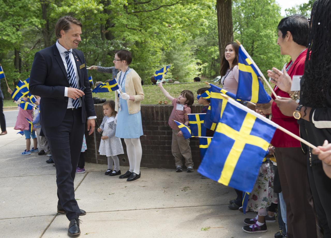 Swedish Delegation visited Goddard on May 3, 2017.  Center Director Chris Scolese greets His Majesty Carl XVI Gustaf, King of Sweden at Bldg 28.  Goddard Child Development Center was on hand with children bearing flags, flowers and a painting of Swedish Linnea flower as a gift.