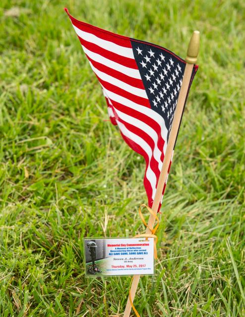 NASA image: Members of the Veterans Advisory Committee place flags on the Go