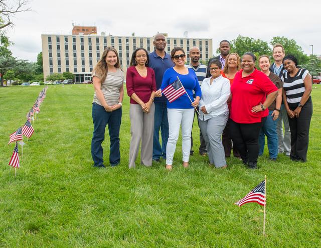 NASA image: Members of the Veterans Advisory Committee place flags on the Go