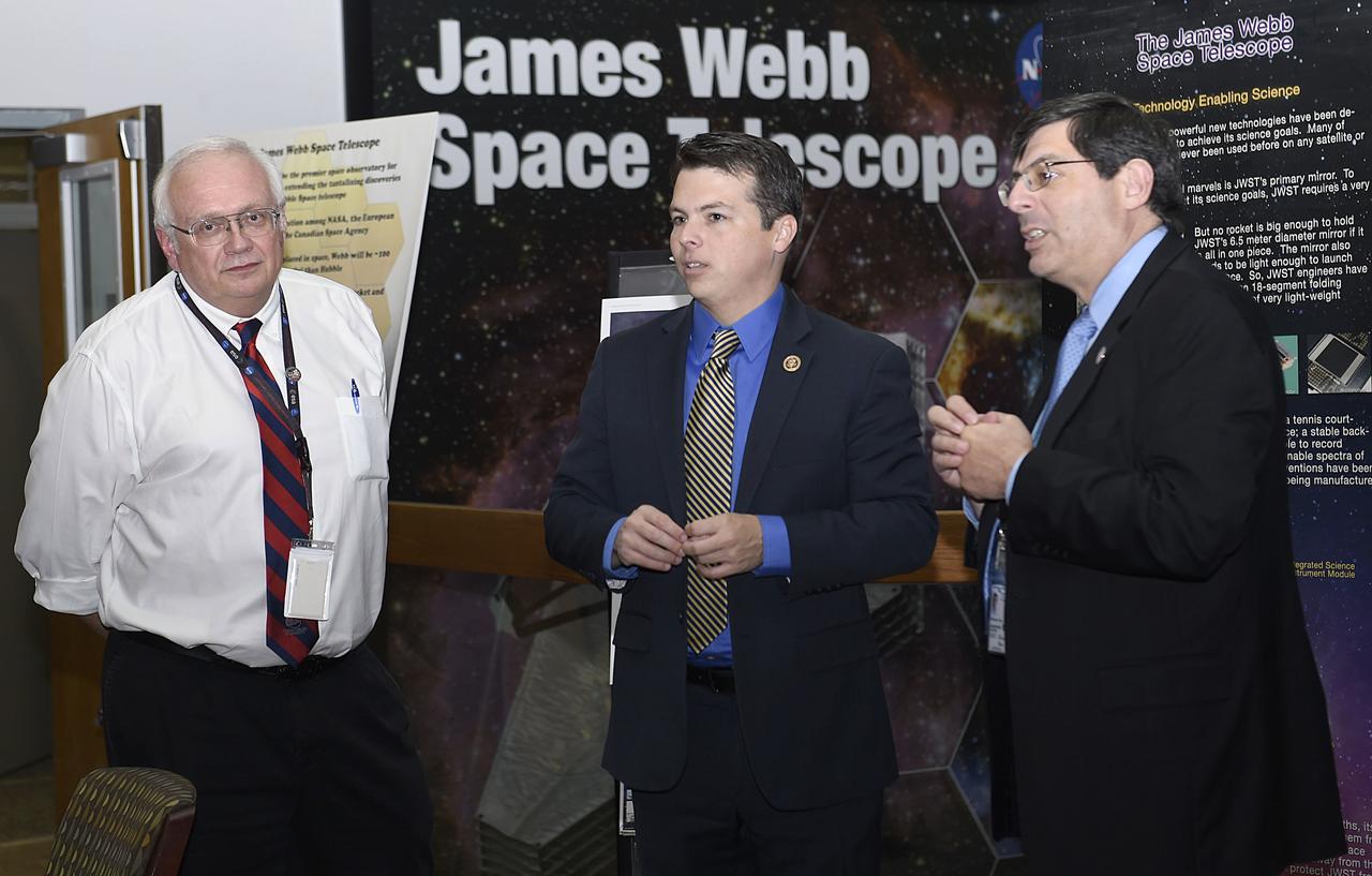 Congressman Brendan Boyle from Pennsylvania visited Goddard on November 14, 2016. Center Director Chris Scolese and Bill Ochs/JWST talk in front of posters in Bldg 29.