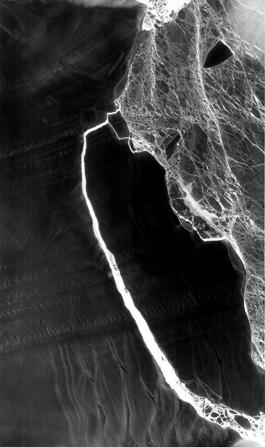 NASA image: NASA Snaps Nighttime View of Massive Iceberg Split