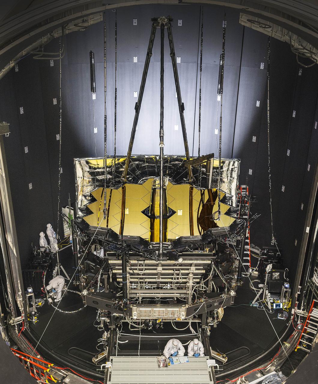 NASA’s James Webb Space Telescope was placed in Johnson Space Center’s historic Chamber A on June 20, 2017, to prepare for its final three months of testing in a cryogenic vacuum that mimics temperatures in space. Engineers will perform the test to prove that the telescope can operate in space at these temperatures. Chamber A will simulate an environment where the telescope will experience extreme cold -- around 37 Kelvin (minus 236 degrees Celsius or minus 393 degrees Fahrenheit). In space, the telescope must be kept extremely cold, in order to be able to detect the infrared light from very faint, distant objects. To protect the telescope from external sources of light and heat (like the sun, Earth, and moon), as well as from heat emitted by the observatory, a five-layer, tennis court-sized sunshield acts like a parasol that provides shade. The sunshield separates the observatory into a warm, sun-facing side (reaching temperatures close to 400 degrees Fahrenheit) and a cold side (185 degrees below zero). The sunshield blocks sunlight from interfering with the sensitive telescope instruments. Read more: <a href="https://go.nasa.gov/2sZAilS" rel="nofollow">go.nasa.gov/2sZAilS</a> <b><a href="http://www.nasa.gov/audience/formedia/features/MP_Photo_Guidelines.html" rel="nofollow">NASA image use policy.</a></b> <b><a href="http://www.nasa.gov/centers/goddard/home/index.html" rel="nofollow">NASA Goddard Space Flight Center</a></b> enables NASA’s mission through four scientific endeavors: Earth Science, Heliophysics, Solar System Exploration, and Astrophysics. Goddard plays a leading role in NASA’s accomplishments by contributing compelling scientific knowledge to advance the Agency’s mission. <b>Follow us on <a href="http://twitter.com/NASAGoddardPix" rel="nofollow">Twitter</a></b> <b>Like us on <a href="http://www.facebook.com/pages/Greenbelt-MD/NASA-Goddard/395013845897?ref=tsd" rel="nofollow">Facebook</a></b> <b>Find us on <a href="http://instagrid.me/nasagoddard/?vm=grid" rel="nofollow">Instagram</a></b>