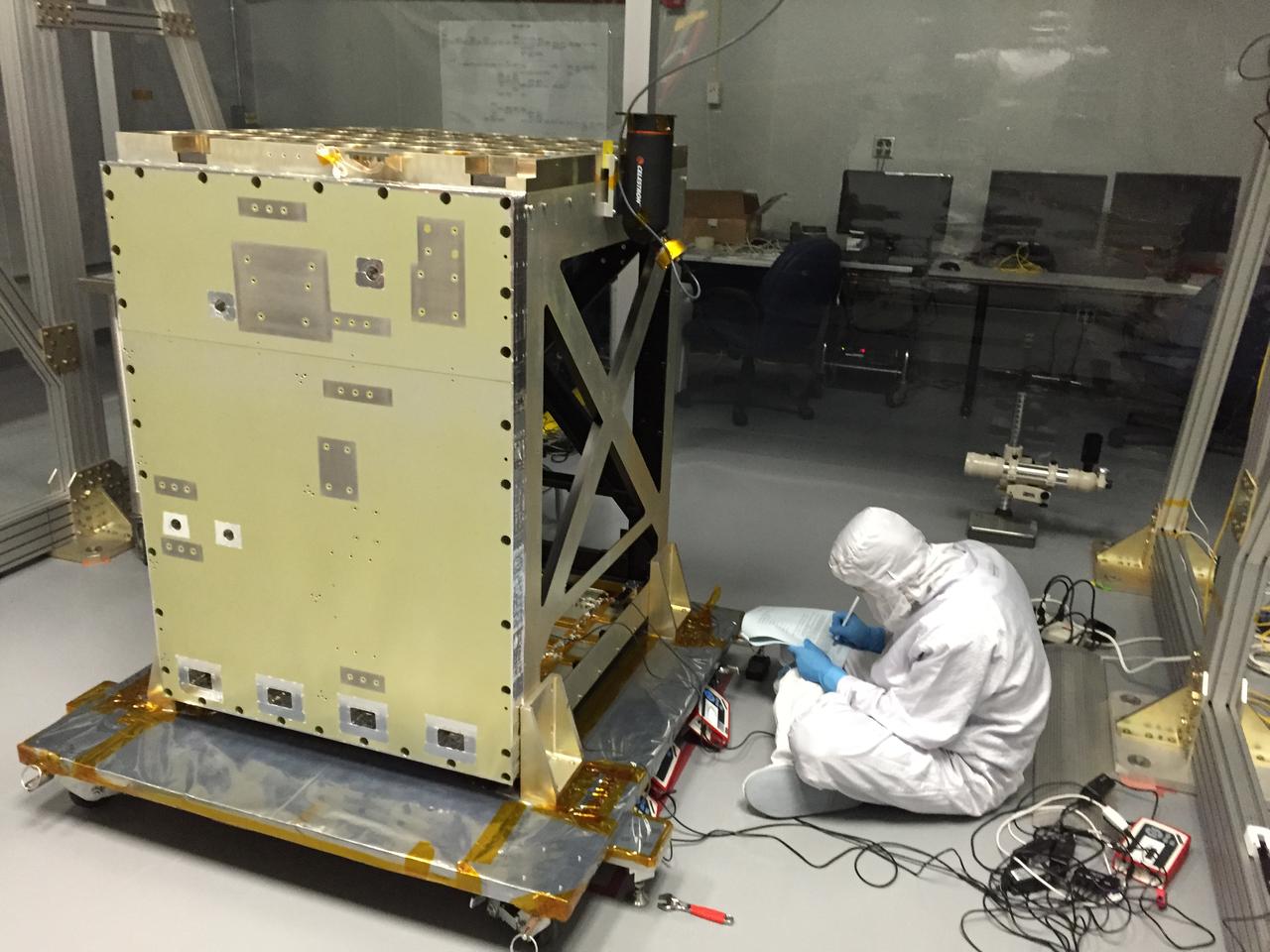 A NICER team member measures the focused optical power of each X-ray concentrator in a clean tent at NASA’s Goddard Space Flight Center. The Neutron star Interior Composition Explorer (NICER) is a NASA Explorer Mission of Opportunity dedicated to studying the extraordinary environments — strong gravity, ultra-dense matter, and the most powerful magnetic fields in the universe — embodied by neutron stars. An attached payload aboard the International Space Station, NICER will deploy an instrument with unique capabilities for timing and spectroscopy of fast X-ray brightness fluctuations. The embedded Station Explorer for X-ray Timing and Navigation Technology demonstration (SEXTANT) will use NICER data to validate, for the first time in space, technology that exploits pulsars as natural navigation beacons. Credit: NASA/Goddard/ Keith Gendreau <b><a href="http://www.nasa.gov/audience/formedia/features/MP_Photo_Guidelines.html" rel="nofollow">NASA image use policy.</a></b> <b><a href="http://www.nasa.gov/centers/goddard/home/index.html" rel="nofollow">NASA Goddard Space Flight Center</a></b> enables NASA’s mission through four scientific endeavors: Earth Science, Heliophysics, Solar System Exploration, and Astrophysics. Goddard plays a leading role in NASA’s accomplishments by contributing compelling scientific knowledge to advance the Agency’s mission. <b>Follow us on <a href="http://twitter.com/NASAGoddardPix" rel="nofollow">Twitter</a></b> <b>Like us on <a href="http://www.facebook.com/pages/Greenbelt-MD/NASA-Goddard/395013845897?ref=tsd" rel="nofollow">Facebook</a></b> <b>Find us on <a href="http://instagrid.me/nasagoddard/?vm=grid" rel="nofollow">Instagram</a></b>