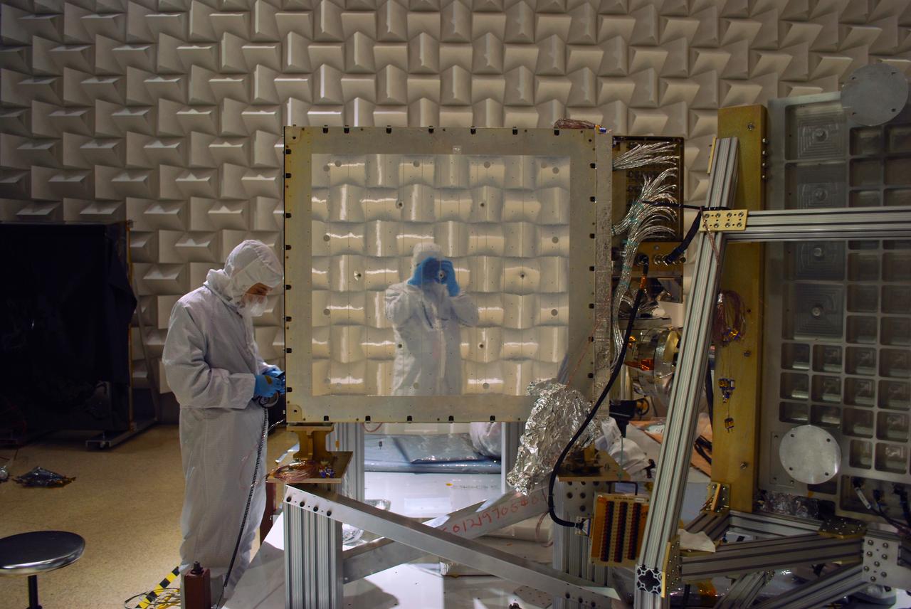 A photo taken during the NICER range-of-motion test at NASA’s Goddard Space Flight Center shows the photographer’s reflection in the mirror-like radiator surface of the detector plate. Teflon-coated silver tape is used to keep NICER’s detectors cool. The Neutron star Interior Composition Explorer (NICER) is a NASA Explorer Mission of Opportunity dedicated to studying the extraordinary environments — strong gravity, ultra-dense matter, and the most powerful magnetic fields in the universe — embodied by neutron stars. An attached payload aboard the International Space Station, NICER will deploy an instrument with unique capabilities for timing and spectroscopy of fast X-ray brightness fluctuations. The embedded Station Explorer for X-ray Timing and Navigation Technology demonstration (SEXTANT) will use NICER data to validate, for the first time in space, technology that exploits pulsars as natural navigation beacons. Credit: NASA/Goddard/ Keith Gendreau <b><a href="http://www.nasa.gov/audience/formedia/features/MP_Photo_Guidelines.html" rel="nofollow">NASA image use policy.</a></b> <b><a href="http://www.nasa.gov/centers/goddard/home/index.html" rel="nofollow">NASA Goddard Space Flight Center</a></b> enables NASA’s mission through four scientific endeavors: Earth Science, Heliophysics, Solar System Exploration, and Astrophysics. Goddard plays a leading role in NASA’s accomplishments by contributing compelling scientific knowledge to advance the Agency’s mission. <b>Follow us on <a href="http://twitter.com/NASAGoddardPix" rel="nofollow">Twitter</a></b> <b>Like us on <a href="http://www.facebook.com/pages/Greenbelt-MD/NASA-Goddard/395013845897?ref=tsd" rel="nofollow">Facebook</a></b> <b>Find us on <a href="http://instagrid.me/nasagoddard/?vm=grid" rel="nofollow">Instagram</a></b>