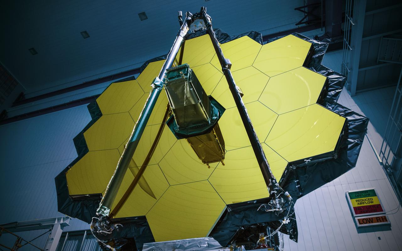 NASA’s James Webb Space Telescope has successfully passed the center of curvature test, an important optical measurement of Webb’s fully assembled primary mirror prior to cryogenic testing, and the last test held at NASA's Goddard Space Flight Center in Greenbelt, Maryland, before the spacecraft is shipped to NASA’s Johnson Space Center in Houston for more testing.  After undergoing rigorous environmental tests simulating the stresses of its rocket launch, the Webb telescope team at Goddard analyzed the results from this critical optical test and compared it to the pre-test measurements. The team concluded that the mirrors passed the test with the optical system unscathed.  “The Webb telescope is about to embark on its next step in reaching the stars as it has successfully completed its integration and testing at Goddard. It has taken a tremendous team of talented individuals to get to this point from all across NASA, our industry and international partners, and academia,” said Bill Ochs, NASA’s Webb telescope project manager. “It is also a sad time as we say goodbye to the Webb Telescope at Goddard, but are excited to begin cryogenic testing at Johnson.”  Rocket launches create high levels of vibration and noise that rattle spacecraft and telescopes. At Goddard, engineers tested the Webb telescope in vibration and acoustics test facilities that simulate the launch environment to ensure that functionality is not impaired by the rigorous ride on a rocket into space.  Before and after these environmental tests took place, optical engineers set up an interferometer, the main device used to measure the shape of the Webb telescope’s mirror. An interferometer gets its name from the process of recording and measuring the ripple patterns that result when different beams of light mix and their waves combine or “interfere.”  Waves of visible light are less than a thousandth of a millimeter long and optics on the Webb telescope need to be shaped and aligned even more accurately than that to work correctly. Making measurements of the mirror shape and position by lasers prevents physical contact and damage (scratches to the mirror). So, scientists use wavelengths of light to make tiny measurements. By measuring light reflected off the optics using an interferometer, they are able to measure extremely small changes in shape or position that may occur after exposing the mirror to a simulated launch or temperatures that simulate the subfreezing environment of space.  During a test conducted by a team from Goddard, Ball Aerospace of Boulder, Colorado, and the Space Telescope Science Institute in Baltimore, temperature and humidity conditions in the clean room were kept incredibly stable to minimize fluctuations in the sensitive optical measurements over time. Even so, tiny vibrations are ever-present in the clean room that cause jitter during measurements, so the interferometer is a “high-speed” one, taking 5,000 “frames” every second, which is a faster rate than the background vibrations themselves. This allows engineers to subtract out jitter and get good, clean results on any changes to the mirror's shape.  Credit: NASA/Goddard/Chris Gunn  Read more: <a href="https://go.nasa.gov/2oPqHwR" rel="nofollow">go.nasa.gov/2oPqHwR</a>  NASA’s Webb Telescope Completes Goddard Testing
