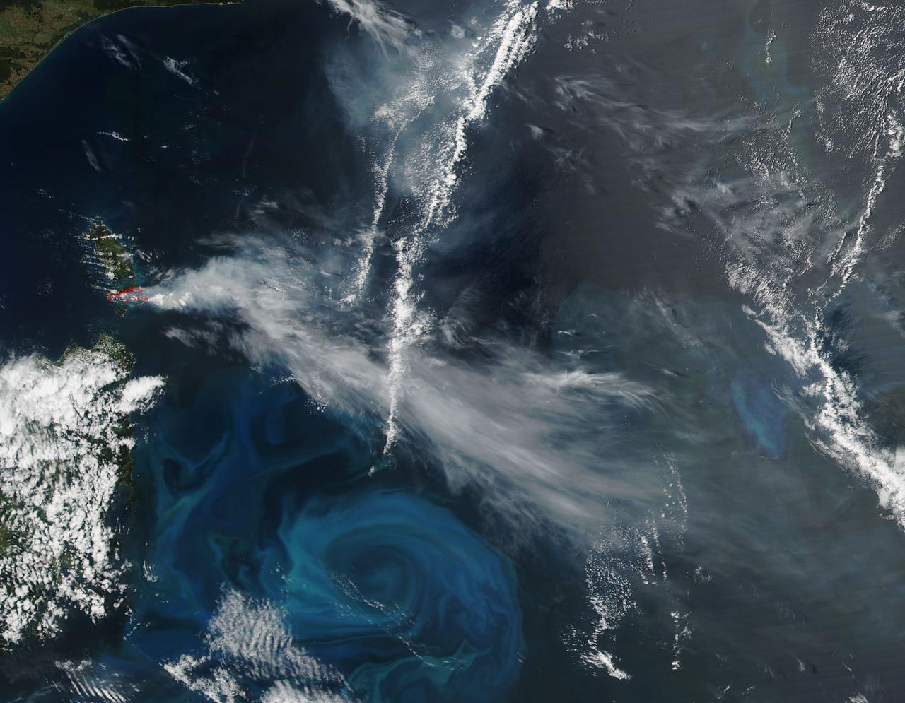 NASA-NOAA's Suomi NPP satellite passed over Australia's Cape Barren Island and captured an image of phytoplankton and smoke from fires that resembled an eye and eyebrow. The Tasmanian Fire Service reported that a vegetation fire near Thunder and Lightning Bay, Cape Barren Island started on December 4 and was still blazing on December 8. Cape Barren Island is one of a trail of islands in the Bass Strait of the South Pacific Ocean, between southeastern Australia and Tasmania. This natural-color satellite image from Dec. 7 was collected by the Visible Infrared Imaging Radiometer Suite (VIIRS) instrument that flies aboard NASA-NOAA's Suomi NPP satellite. The red dots in the image represent heat signatures from the fires as detected by VIIRS. A light grey stream of smoke was blowing to the southeast in what could be seen as the "eyebrow" to the "eye" or swirl of blue and green phytoplankton below it. Phytoplankton are tiny microscopic plant-like organisms that form the base of the marine food chain. Like land plants, phytoplankton contain chlorophyll which is used in photosynthesis to turn sunlight into chemical energy. The chlorophyll gives the phytoplankton their green color, which is visible from space when large numbers of the organism group together. NASA image courtesy MODIS Rapid Response Team #nasagoddard #earth #smoke #Phytoplankton #science b><a href="http://www.nasa.gov/audience/formedia/features/MP_Photo_Guidelines.html" rel="nofollow">NASA image use policy.</a> <b><a href="http://www.nasa.gov/centers/goddard/home/index.html" rel="nofollow">NASA Goddard Space Flight Center</a></b> enables NASA’s mission through four scientific endeavors: Earth Science, Heliophysics, Solar System Exploration, and Astrophysics. Goddard plays a leading role in NASA’s accomplishments by contributing compelling scientific knowledge to advance the Agency’s mission. <b>Follow us on <a href="http://twitter.com/NASAGoddardPix" rel="nofollow">Twitter</a></b> <b>Like us on <a href="http://www.facebook.com/pages/Greenbelt-MD/NASA-Goddard/395013845897?ref=tsd" rel="nofollow">Facebook</a></b> <b>Find us on <a href="http://instagrid.me/nasagoddard/?vm=grid" rel="nofollow">Instagram</a></b>