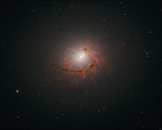 New observations from the NASA/ESA Hubble Space Telescope have revealed the intricate structure of the galaxy NGC 4696 in greater detail than ever before. The elliptical galaxy is a beautiful cosmic oddity with a bright core wrapped in system of dark, swirling, thread-like filaments. Read more: <a href="http://bit.ly/2gLGojx" rel="nofollow">bit.ly/2gLGojx</a> <b><a href="http://www.nasa.gov/audience/formedia/features/MP_Photo_Guidelines.html" rel="nofollow">NASA image use policy.</a></b> <b><a href="http://www.nasa.gov/centers/goddard/home/index.html" rel="nofollow">NASA Goddard Space Flight Center</a></b> enables NASA’s mission through four scientific endeavors: Earth Science, Heliophysics, Solar System Exploration, and Astrophysics. Goddard plays a leading role in NASA’s accomplishments by contributing compelling scientific knowledge to advance the Agency’s mission. <b>Follow us on <a href="http://twitter.com/NASAGoddardPix" rel="nofollow">Twitter</a></b> <b>Like us on <a href="http://www.facebook.com/pages/Greenbelt-MD/NASA-Goddard/395013845897?ref=tsd" rel="nofollow">Facebook</a></b> <b>Find us on <a href="http://instagrid.me/nasagoddard/?vm=grid" rel="nofollow">Instagram</a></b>