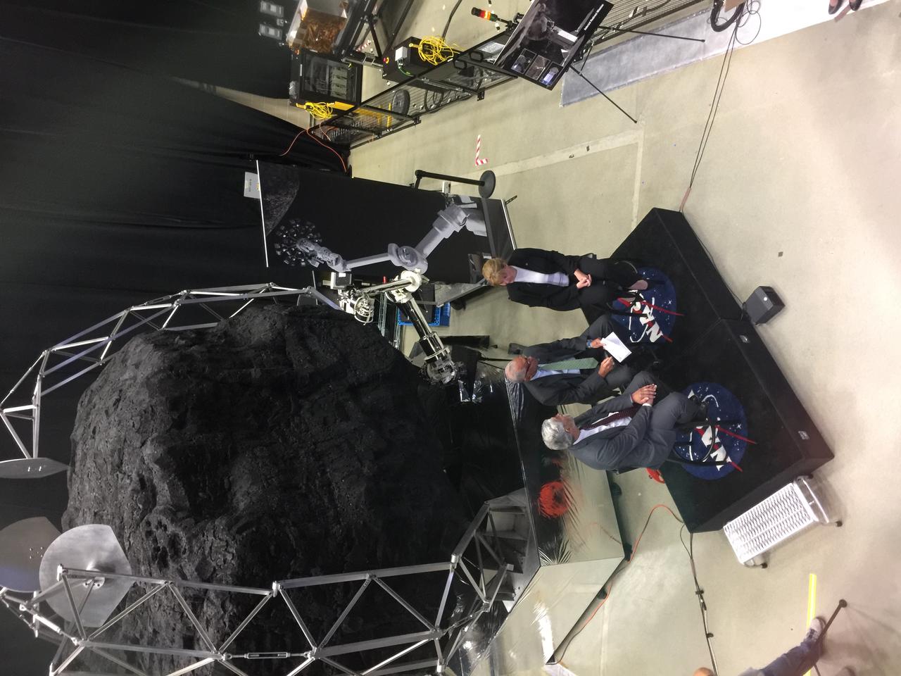 Dr. Holdren (left), Administrator Bolden (center) and Dr. Michele Gates (right) discuss the ARM mission during a live NASA TV briefing. Behind them is a mockup of robotic capture module for the Asteroid Redirect Mission. More info: Asteroid Redirect Mission Update – On Sept. 14, 2016, NASA provided an update on the Asteroid Redirect Mission (ARM) and how it contributes to the agency’s journey to Mars and protection of Earth. The presentation took place in the Robotic Operations Center at NASA’s Goddard Space Flight Center in Greenbelt, Maryland. Assistant to the President for Science and Technology Dr. John P. Holdren, NASA Administrator Charles Bolden and NASA’s ARM Program Director, Dr. Michele Gates discussed the latest update regarding the mission. They explained the mission’s scientific and technological benefits and how ARM will demonstrate technology for defending Earth from potentially hazardous asteroids. The briefing aired live on NASA TV and the agency’s website. For more information about ARM go to <a href="https://www.nasa.gov/arm" rel="nofollow">www.nasa.gov/arm</a>. Credit: NASA/Goddard/Peter Sooy <b><a href="http://www.nasa.gov/audience/formedia/features/MP_Photo_Guidelines.html" rel="nofollow">NASA image use policy.</a></b> <b><a href="http://www.nasa.gov/centers/goddard/home/index.html" rel="nofollow">NASA Goddard Space Flight Center</a></b> enables NASA’s mission through four scientific endeavors: Earth Science, Heliophysics, Solar System Exploration, and Astrophysics. Goddard plays a leading role in NASA’s accomplishments by contributing compelling scientific knowledge to advance the Agency’s mission. <b>Follow us on <a href="http://twitter.com/NASAGoddardPix" rel="nofollow">Twitter</a></b> <b>Like us on <a href="http://www.facebook.com/pages/Greenbelt-MD/NASA-Goddard/395013845897?ref=tsd" rel="nofollow">Facebook</a></b> <b>Find us on <a href="http://instagrid.me/nasagoddard/?vm=grid" rel="nofollow">Instagram</a></b>