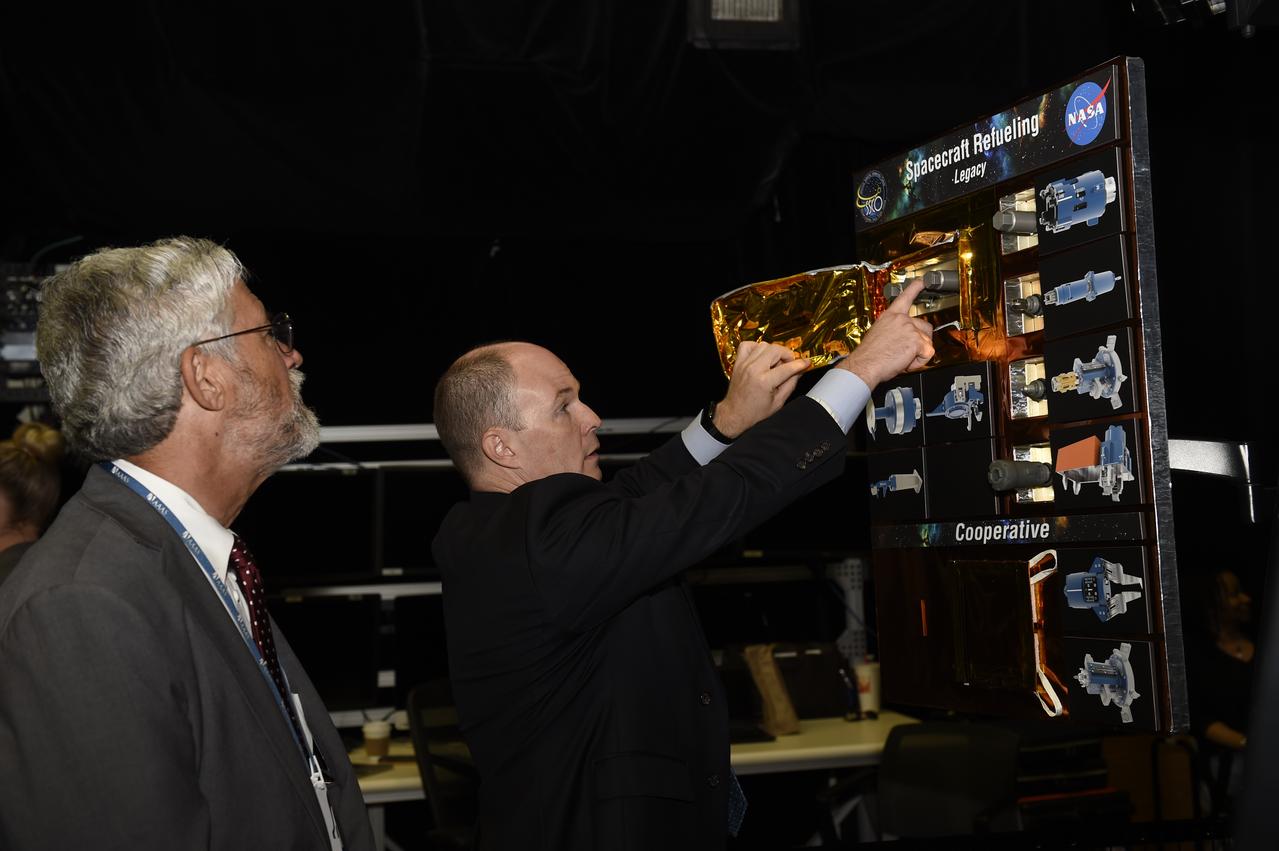 Benjamin Reed (right), deputy program manager of NASA’s Satellite Servicing Capabilities Office, shows Dr. Holdren the technologies that NASA is developing for the Restore-L satellite servicing mission. NASA will launch the Restore-L servicer in 2020 to refuel a live satellite and demonstrate that a suite of satellite-servicing technologies are operational. More info: Asteroid Redirect Mission Update – On Sept. 14, 2016, NASA provided an update on the Asteroid Redirect Mission (ARM) and how it contributes to the agency’s journey to Mars and protection of Earth. The presentation took place in the Robotic Operations Center at NASA’s Goddard Space Flight Center in Greenbelt, Maryland. Assistant to the President for Science and Technology Dr. John P. Holdren, NASA Administrator Charles Bolden and NASA’s ARM Program Director, Dr. Michele Gates discussed the latest update regarding the mission. They explained the mission’s scientific and technological benefits and how ARM will demonstrate technology for defending Earth from potentially hazardous asteroids. The briefing aired live on NASA TV and the agency’s website. For more information about ARM go to <a href="https://www.nasa.gov/arm" rel="nofollow">www.nasa.gov/arm</a>. Credit: NASA/Goddard/Debbie Mccallum <b><a href="http://www.nasa.gov/audience/formedia/features/MP_Photo_Guidelines.html" rel="nofollow">NASA image use policy.</a></b> <b><a href="http://www.nasa.gov/centers/goddard/home/index.html" rel="nofollow">NASA Goddard Space Flight Center</a></b> enables NASA’s mission through four scientific endeavors: Earth Science, Heliophysics, Solar System Exploration, and Astrophysics. Goddard plays a leading role in NASA’s accomplishments by contributing compelling scientific knowledge to advance the Agency’s mission. <b>Follow us on <a href="http://twitter.com/NASAGoddardPix" rel="nofollow">Twitter</a></b> <b>Like us on <a href="http://www.facebook.com/pages/Greenbelt-MD/NASA-Goddard/395013845897?ref=tsd" rel="nofollow">Facebook</a></b> <b>Find us on <a href="http://instagrid.me/nasagoddard/?vm=grid" rel="nofollow">Instagram</a></b>