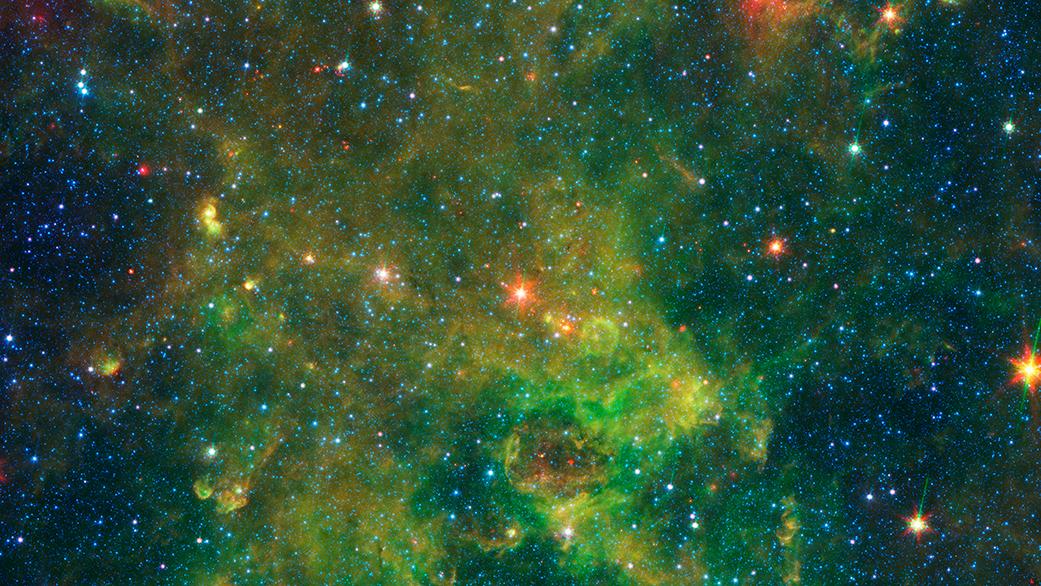 An age-defying star designated as IRAS 19312+1950 exhibits features characteristic of a very young star and a very old star. The object stands out as extremely bright inside a large, chemically rich cloud of material, as shown in this image from NASA’s Spitzer Space Telescope. A NASA-led team of scientists thinks the star – which is about 10 times as massive as our sun and emits about 20,000 times as much energy – is a newly forming protostar. That was a big surprise because the region had not been known as a stellar nursery before. But the presence of a nearby interstellar bubble, which indicates the presence of a recently formed massive star, also supports this idea.  Read more: <a href="http://go.nasa.gov/2bMza9d" rel="nofollow">go.nasa.gov/2bMza9d</a>  Image Credit: NASA/JPL-Caltech 