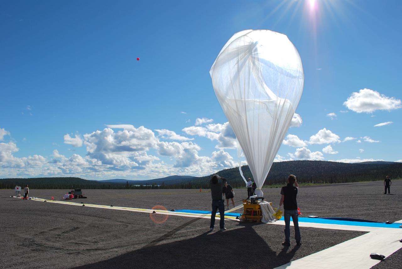 The BARREL team prepares to launch their third payload from Esrange Space Center near Kiruna, Sweden, on Aug. 21, 2016.    The BARREL team is at Esrange Space Center launching a series of six scientific payloads on miniature scientific balloons. The NASA-funded BARREL – which stands for Balloon Array for Radiation-belt Relativistic Electron Losses – primarily measures X-rays in Earth’s atmosphere near the North and South Poles. These X-rays are produced by electrons raining down into the atmosphere from two giant swaths of radiation that surround Earth, called the Van Allen belts. Learning about the radiation near Earth helps us to better protect our satellites.   Several of the BARREL balloons also carry instruments built by undergraduate students to measure the total electron content of Earth’s ionosphere, as well as the low-frequency electromagnetic waves that help to scatter electrons into Earth’s atmosphere. Though about 90 feet in diameter, the BARREL balloons are much smaller than standard football stadium-sized scientific balloons.  This is the fourth campaign for the BARREL mission. BARREL is led by Dartmouth College in Hanover, New Hampshire. The undergraduate student instrument team is led by the University of Houston and funded by the Undergraduate Student Instrument Project out of NASA’s Wallops Flight Facility. For more information on NASA’s scientific balloon program, visit: <a href="http://www.nasa.gov/scientificballoons" rel="nofollow">www.nasa.gov/scientificballoons</a>.   Credit: NASA/University of Houston/Michael Greer   <b><a href="http://www.nasa.gov/audience/formedia/features/MP_Photo_Guidelines.html" rel="nofollow">NASA image use policy.</a></b>  <b><a href="http://www.nasa.gov/centers/goddard/home/index.html" rel="nofollow">NASA Goddard Space Flight Center</a></b> enables NASA’s mission through four scientific endeavors: Earth Science, Heliophysics, Solar System Exploration, and Astrophysics. Goddard plays a leading role in NASA’s accomplishments by contributing compelling scientific knowledge to advance the Agency’s mission.  <b>Follow us on <a href="http://twitter.com/NASAGoddardPix" rel="nofollow">Twitter</a></b>  <b>Like us on <a href="http://www.facebook.com/pages/Greenbelt-MD/NASA-Goddard/395013845897?ref=tsd" rel="nofollow">Facebook</a></b>  <b>Find us on <a href="http://instagrid.me/nasagoddard/?vm=grid" rel="nofollow">Instagram</a></b>