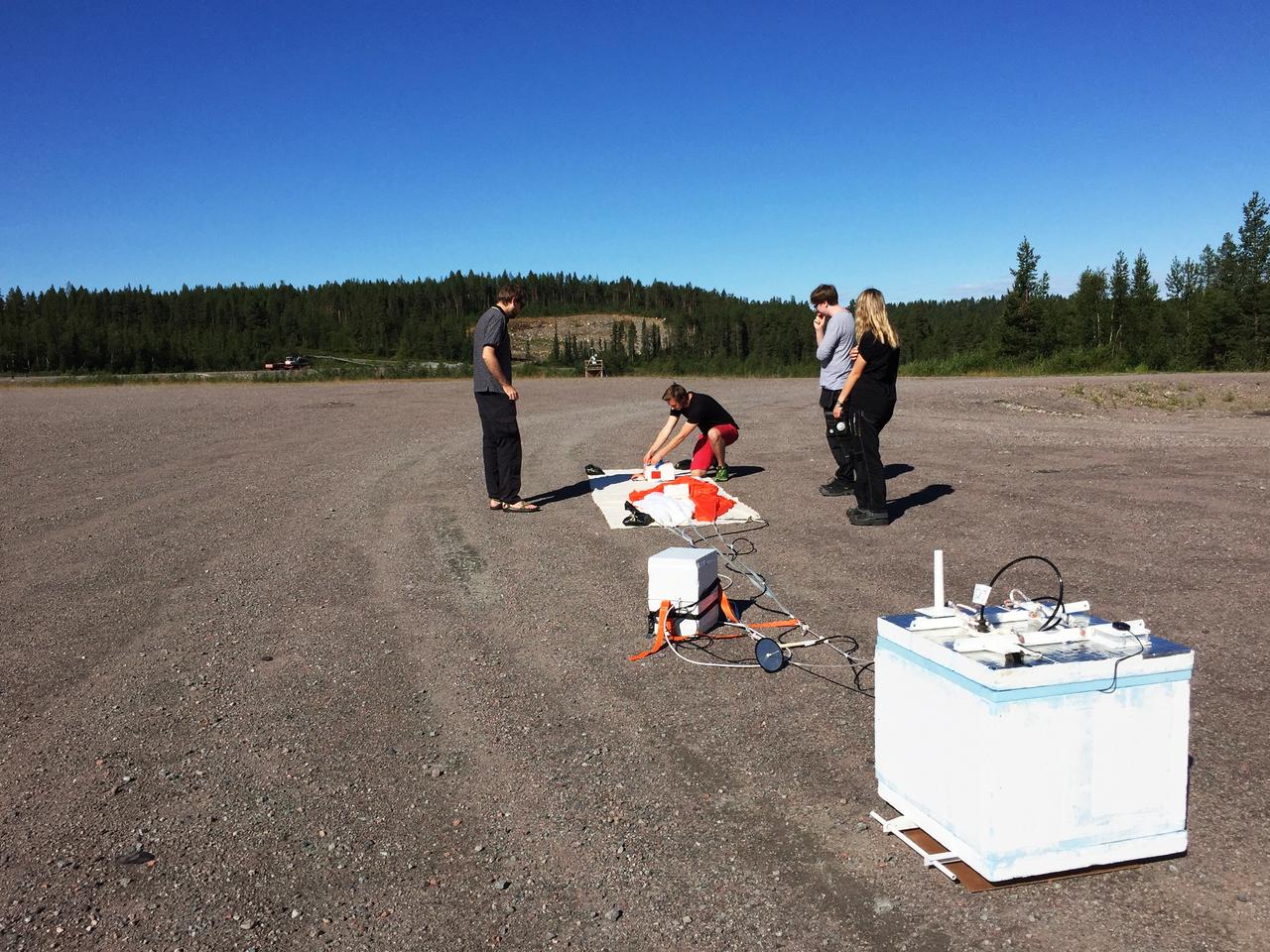 Prior to launch, the BARREL team works on the payload from the launch pad at Esrange Space Center near Kiruna, Sweden.   The BARREL team is at Esrange Space Center launching a series of six scientific payloads on miniature scientific balloons. The NASA-funded BARREL – which stands for Balloon Array for Radiation-belt Relativistic Electron Losses – primarily measures X-rays in Earth’s atmosphere near the North and South Poles. These X-rays are produced by electrons raining down into the atmosphere from two giant swaths of radiation that surround Earth, called the Van Allen belts. Learning about the radiation near Earth helps us to better protect our satellites.   Several of the BARREL balloons also carry instruments built by undergraduate students to measure the total electron content of Earth’s ionosphere, as well as the low-frequency electromagnetic waves that help to scatter electrons into Earth’s atmosphere. Though about 90 feet in diameter, the BARREL balloons are much smaller than standard football stadium-sized scientific balloons.  This is the fourth campaign for the BARREL mission. BARREL is led by Dartmouth College in Hanover, New Hampshire. The undergraduate student instrument team is led by the University of Houston and funded by the Undergraduate Student Instrument Project out of NASA’s Wallops Flight Facility. For more information on NASA’s scientific balloon program, visit: <a href="http://www.nasa.gov/scientificballoons" rel="nofollow">www.nasa.gov/scientificballoons</a>.   Image credit: NASA/Dartmouth/Robyn Millan   <b><a href="http://www.nasa.gov/audience/formedia/features/MP_Photo_Guidelines.html" rel="nofollow">NASA image use policy.</a></b>  <b><a href="http://www.nasa.gov/centers/goddard/home/index.html" rel="nofollow">NASA Goddard Space Flight Center</a></b> enables NASA’s mission through four scientific endeavors: Earth Science, Heliophysics, Solar System Exploration, and Astrophysics. Goddard plays a leading role in NASA’s accomplishments by contributing compelling scientific knowledge to advance the Agency’s mission.  <b>Follow us on <a href="http://twitter.com/NASAGoddardPix" rel="nofollow">Twitter</a></b>  <b>Like us on <a href="http://www.facebook.com/pages/Greenbelt-MD/NASA-Goddard/395013845897?ref=tsd" rel="nofollow">Facebook</a></b>  <b>Find us on <a href="http://instagrid.me/nasagoddard/?vm=grid" rel="nofollow">Instagram</a></b>     