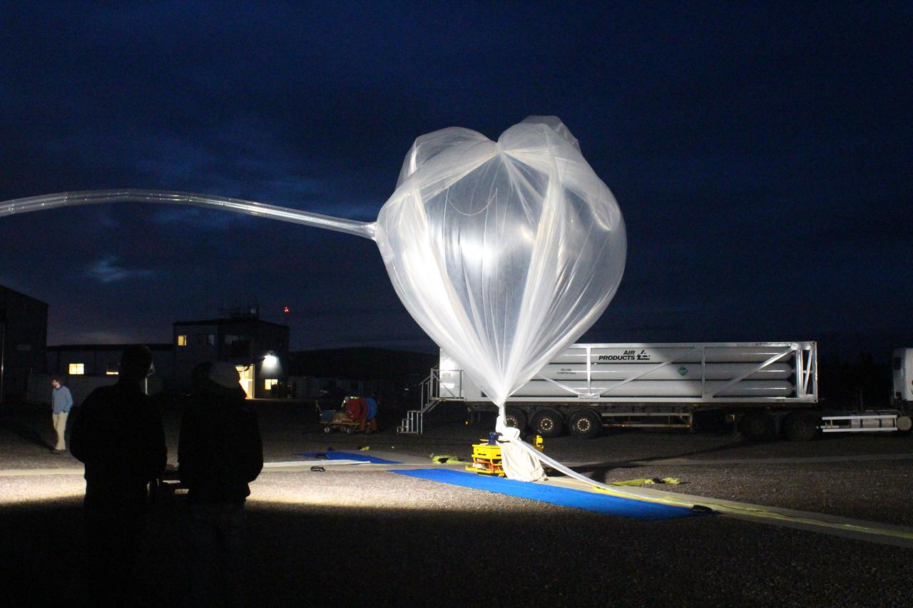 The first BARREL balloon is inflated just before its launch on Aug. 13, 2016, from Esrange Space Center near Kiruna, Sweden.   The BARREL team is at Esrange Space Center launching a series of six scientific payloads on miniature scientific balloons. The NASA-funded BARREL – which stands for Balloon Array for Radiation-belt Relativistic Electron Losses – primarily measures X-rays in Earth’s atmosphere near the North and South Poles. These X-rays are produced by electrons raining down into the atmosphere from two giant swaths of radiation that surround Earth, called the Van Allen belts. Learning about the radiation near Earth helps us to better protect our satellites.   Several of the BARREL balloons also carry instruments built by undergraduate students to measure the total electron content of Earth’s ionosphere, as well as the low-frequency electromagnetic waves that help to scatter electrons into Earth’s atmosphere. Though about 90 feet in diameter, the BARREL balloons are much smaller than standard football stadium-sized scientific balloons.  This is the fourth campaign for the BARREL mission. BARREL is led by Dartmouth College in Hanover, New Hampshire. The undergraduate student instrument team is led by the University of Houston and funded by the Undergraduate Student Instrument Project out of NASA’s Wallops Flight Facility. For more information on NASA’s scientific balloon program, visit: <a href="http://www.nasa.gov/scientificballoons" rel="nofollow">www.nasa.gov/scientificballoons</a>.   Image credit: NASA/University of Houston/Edgar Bering  <b><a href="http://www.nasa.gov/audience/formedia/features/MP_Photo_Guidelines.html" rel="nofollow">NASA image use policy.</a></b>  <b><a href="http://www.nasa.gov/centers/goddard/home/index.html" rel="nofollow">NASA Goddard Space Flight Center</a></b> enables NASA’s mission through four scientific endeavors: Earth Science, Heliophysics, Solar System Exploration, and Astrophysics. Goddard plays a leading role in NASA’s accomplishments by contributing compelling scientific knowledge to advance the Agency’s mission.  <b>Follow us on <a href="http://twitter.com/NASAGoddardPix" rel="nofollow">Twitter</a></b>  <b>Like us on <a href="http://www.facebook.com/pages/Greenbelt-MD/NASA-Goddard/395013845897?ref=tsd" rel="nofollow">Facebook</a></b>  <b>Find us on <a href="http://instagrid.me/nasagoddard/?vm=grid" rel="nofollow">Instagram</a></b>    
