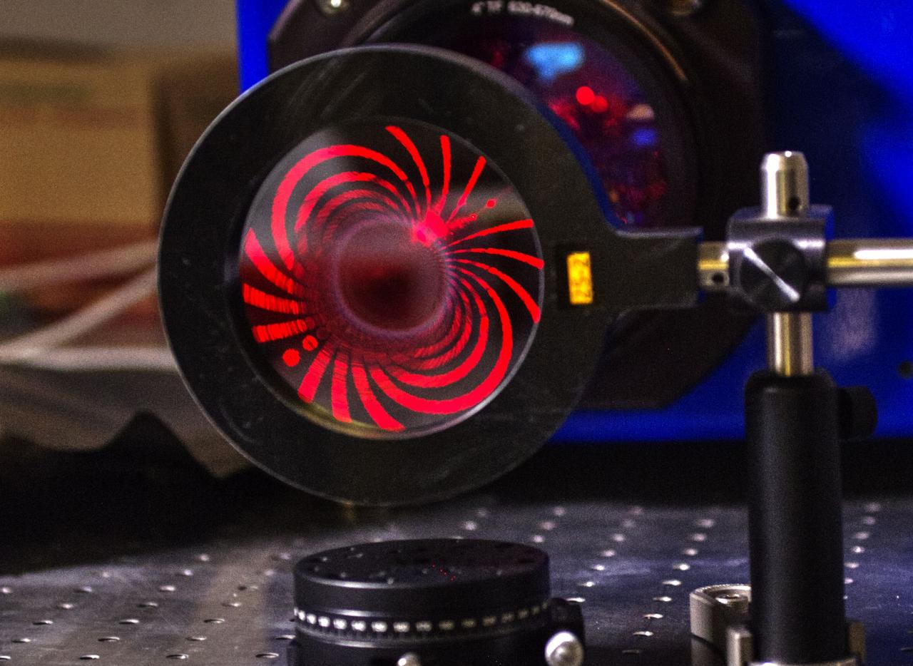 It’s an age-old astronomical truth: To resolve smaller and smaller physical details of distant celestial objects, scientists need larger and larger light-collecting mirrors. This challenge is not easily overcome given the high cost and impracticality of building and — in the case of space observatories — launching large-aperture telescopes. However, a team of scientists and engineers at NASA’s Goddard Space Flight Center in Greenbelt, Maryland, has begun testing a potentially more affordable alternative called the photon sieve. This new-fangled telescope optic could give scientists the resolution they need to see finer details still invisible with current observing tools – a jump in resolution that could help answer a 50-year-old question about the physical processes heating the sun's million-degree corona. Read more: <a href="http://go.nasa.gov/2abhanr" rel="nofollow">go.nasa.gov/2abhanr</a> Credit: NASA/Goddard/W. Hrybyk