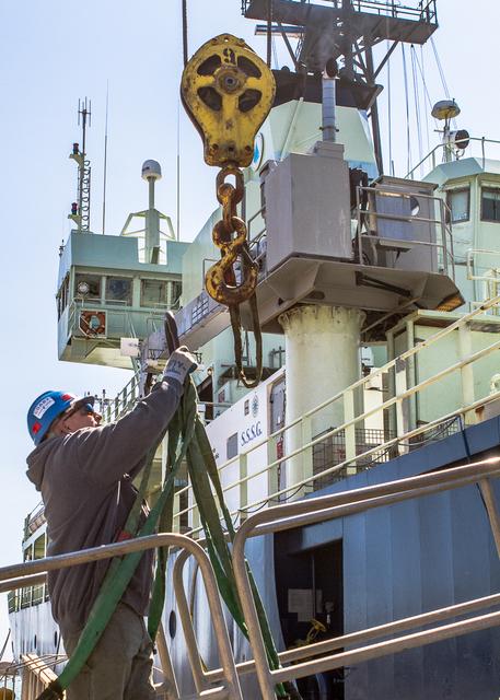 The departure imminent, a port side team member prepares to attach the Atlantis gangway to a crane so it can be removed. --- The <b><a href="http://naames.larc.nasa.gov/" rel="nofollow">North Atlantic Aerosols and Marine Ecosystems Study </a></b> (NAAMES) is a five year investigation to resolve key processes controlling ocean system function, their influences on atmospheric aerosols and clouds and their implications for climate. Michael Starobin joined the NAAMES field campaign on behalf of Earth Expeditions and NASA Goddard Space Flight Center’s Office of Communications. He presented stories about the important, multi-disciplinary research being conducted by the NAAMES team, with an eye towards future missions on the NASA drawing board. This is a NAAMES photo essay put together by Starobin, a collection of 49 photographs and captions. Photo and Caption Credit: Michael Starobin <b><a href="http://www.nasa.gov/audience/formedia/features/MP_Photo_Guidelines.html" rel="nofollow">NASA image use policy</a></b> <b><a href="http://www.nasa.gov/centers/goddard/home/index.html" rel="nofollow">NASA Goddard Space Flight Center</a></b> enables NASA’s mission through four scientific endeavors: Earth Science, Heliophysics, Solar System Exploration, and Astrophysics. Goddard plays a leading role in NASA’s accomplishments by contributing compelling scientific knowledge to advance the Agency’s mission. <b>Follow us on <a href="http://twitter.com/NASAGoddardPix" rel="nofollow">Twitter</a></b> <b>Like us on <a href="http://www.facebook.com/pages/Greenbelt-MD/NASA-Goddard/395013845897?ref=tsd" rel="nofollow">Facebook</a></b> <b>Find us on <a href="https://www.instagram.com/nasagoddard/?hl=en" rel="nofollow">Instagram</a></b>