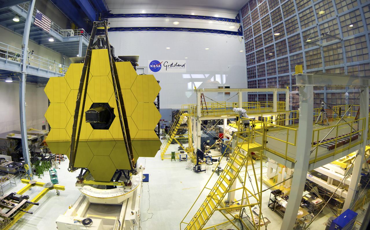 Webb Mirror Tilt Panorama, May 4, 2016 This image is a composite of nine wide-angle photos of the biggest clean room at NASA Goddard on May 4, 2016, when the uncovered flight primary mirror of the James Webb Space Telescope was tilted into a vertical position.  Credit: NASA/Francis Reddy (Syneren Technologies)  <b><a href="http://www.nasa.gov/audience/formedia/features/MP_Photo_Guidelines.html" rel="nofollow">NASA image use policy.</a></b>  <b><a href="http://www.nasa.gov/centers/goddard/home/index.html" rel="nofollow">NASA Goddard Space Flight Center</a></b> enables NASA’s mission through four scientific endeavors: Earth Science, Heliophysics, Solar System Exploration, and Astrophysics. Goddard plays a leading role in NASA’s accomplishments by contributing compelling scientific knowledge to advance the Agency’s mission.  <b>Follow us on <a href="http://twitter.com/NASAGoddardPix" rel="nofollow">Twitter</a></b>  <b>Like us on <a href="http://www.facebook.com/pages/Greenbelt-MD/NASA-Goddard/395013845897?ref=tsd" rel="nofollow">Facebook</a></b>  <b>Find us on <a href="http://instagrid.me/nasagoddard/?vm=grid" rel="nofollow">Instagram</a></b>      