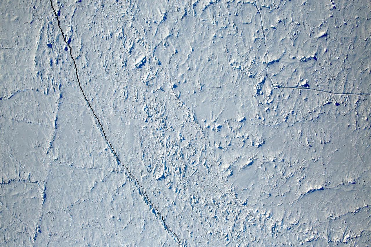 Want to know what the North Pole looked like yesterday afternoon?   Well, our friends from NASA Operation IceBridge brought us this view from 500 meters about the North Pole.  So what are you seeing? That's sea ice, with a few ridges and a bit of snow cover, and with a few small cracks, almost leads in the ice.  Credit: NASA/Goddard/Operation IceBridge/Eric Fraim