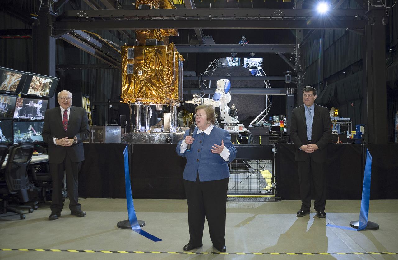 Sen. Barbara Mikulski participated in a ribbon cutting at NASA’s Goddard Space Flight Center on January 6th, 2016, to officially open the new Robotic Operations Center (ROC) developed by the Satellite Servicing Capabilities Office (SSCO).  In this image, she is joined by Chris Scolese, Goddard Center Director (right) and Frank Cepollina, Associate Director of the SSCO (left).  Within the ROC's black walls, NASA is testing technologies and operational procedures for science and exploration missions, including the Restore-L satellite servicing mission and also the Asteroid Redirect Mission.   During her tour of the ROC, Sen. Mikulski saw first-hand an early version of the NASA Servicing Arm, a 2-meter-class robot with the dexterity to grasp and refuel a satellite on orbit. She also heard a description of Raven, a payload launching to the International Space Station that will demonstrate real-time, relative space navigation technology.  The robotic technologies that NASA is developing within the ROC also support the Journey to Mars.  Learn more about NASA’s satellite servicing technologies at <a href="http://ssco.gsfc.nasa.gov/" rel="nofollow">ssco.gsfc.nasa.gov/</a>.  Image credit: NASA/Chris Gunn   Read more: <a href="http://www.nasa.gov/feature/goddard/2016/maryland-sen-barbara-mikulski-visits-nasa-goddard" rel="nofollow">www.nasa.gov/feature/goddard/2016/maryland-sen-barbara-mi...</a>  <b><a href="http://www.nasa.gov/audience/formedia/features/MP_Photo_Guidelines.html" rel="nofollow">NASA image use policy.</a></b>  <b><a href="http://www.nasa.gov/centers/goddard/home/index.html" rel="nofollow">NASA Goddard Space Flight Center</a></b> enables NASA’s mission through four scientific endeavors: Earth Science, Heliophysics, Solar System Exploration, and Astrophysics. Goddard plays a leading role in NASA’s accomplishments by contributing compelling scientific knowledge to advance the Agency’s mission.  <b>Follow us on <a href="http://twitter.com/NASAGoddardPix" rel="nofollow">Twitter</a></b>  <b>Like us on <a href="http://www.facebook.com/pages/Greenbelt-MD/NASA-Goddard/395013845897?ref=tsd" rel="nofollow">Facebook</a></b>  <b>Find us on <a href="http://instagrid.me/nasagoddard/?vm=grid" rel="nofollow">Instagram</a></b>