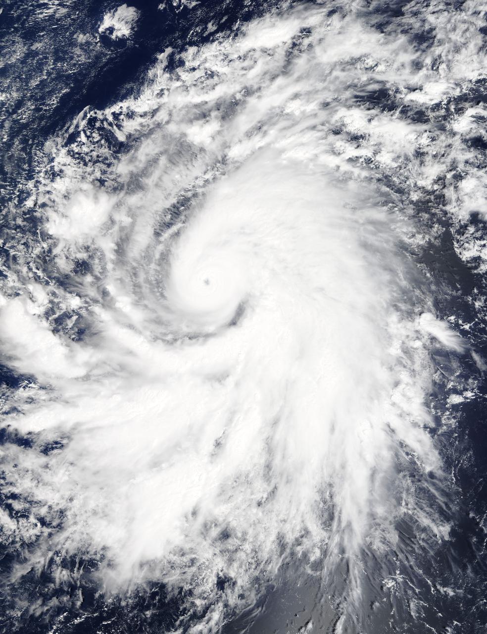On Oct. 19 at 19:35 UTC (3:35 p.m. EDT) the MODIS instrument aboard NASA's Terra satellite saw Hurricane Olaf moving into the central Pacific Ocean with a visible eye. Powerful thunderstorms circled the eye and extended in a thick band in the eastern quadrant from north to south. At 5 a.m. EDT (0900 UTC) on Oct. 20, Hurricane Olaf's center was located near latitude 10.3 north and longitude 140.4 west. That's about 1,175 miles (1,890 km) east-southeast of Hilo, Hawaii. Despite being so far from Hawaii and because Olaf is a powerful hurricane, large swells generated by Olaf will begin to arrive along east facing shores of the main Hawaiian Islands over the next couple of days. The CPHC said that resultant surf will be large...potentially life-threatening and damaging. Olaf is moving toward the west-northwest near 10 mph (17 kph) and the Central Pacific Hurricane Center (CPHC), who has taken over forecast responsibilities now that Olaf has crossed the 140 degree longitude line, expects Olaf to turn toward the west-northwest and then northwest by October 21. Maximum sustained winds are near 150 mph (240 kph). Olaf is a category four hurricane on the Saffir-Simpson Hurricane wind scale. Some additional strengthening is forecast on Tuesday, Oct. 20 and fluctuations in intensity are possible Tuesday night and Wednesday. The estimated minimum central pressure is 938 millibars. Olaf is expected to remain a major hurricane for the next couple of days and begin curving to the northeast and away from Hawaii by Friday, October 23. For updates, visit: <a href="http://www.prh.noaa.gov/cphc" rel="nofollow">www.prh.noaa.gov/cphc</a>. Credit: NASA Goddard's MODIS Rapid Response Team <b><a href="http://www.nasa.gov/audience/formedia/features/MP_Photo_Guidelines.html" rel="nofollow">NASA image use policy.</a></b> <b><a href="http://www.nasa.gov/centers/goddard/home/index.html" rel="nofollow">NASA Goddard Space Flight Center</a></b> enables NASA’s mission through four scientific endeavors: Earth Science, Heliophysics, Solar System Exploration, and Astrophysics. Goddard plays a leading role in NASA’s accomplishments by contributing compelling scientific knowledge to advance the Agency’s mission. <b>Follow us on <a href="http://twitter.com/NASAGoddardPix" rel="nofollow">Twitter</a></b> <b>Like us on <a href="http://www.facebook.com/pages/Greenbelt-MD/NASA-Goddard/395013845897?ref=tsd" rel="nofollow">Facebook</a></b> <b>Find us on <a href="http://instagrid.me/nasagoddard/?vm=grid" rel="nofollow">Instagram</a></b>