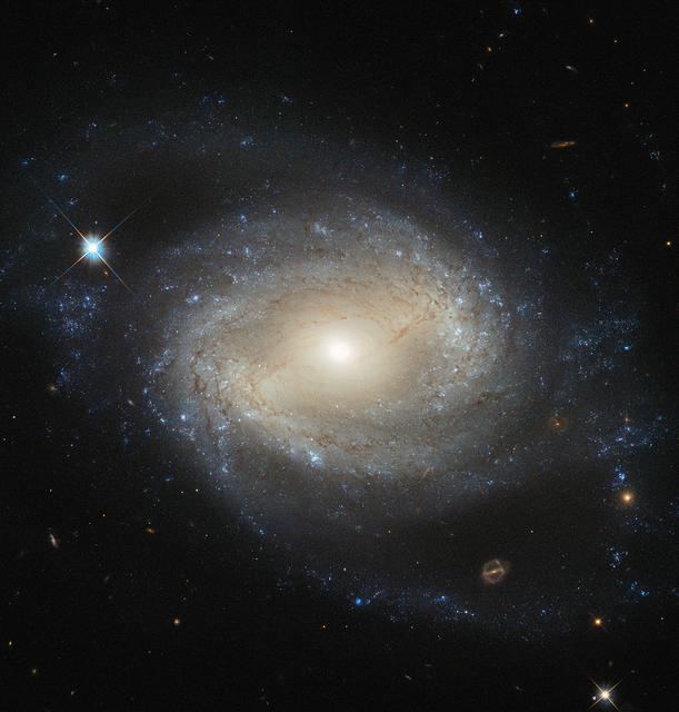 NASA image: Hubble Sees Elegant Spiral Hiding a Hungry Monster