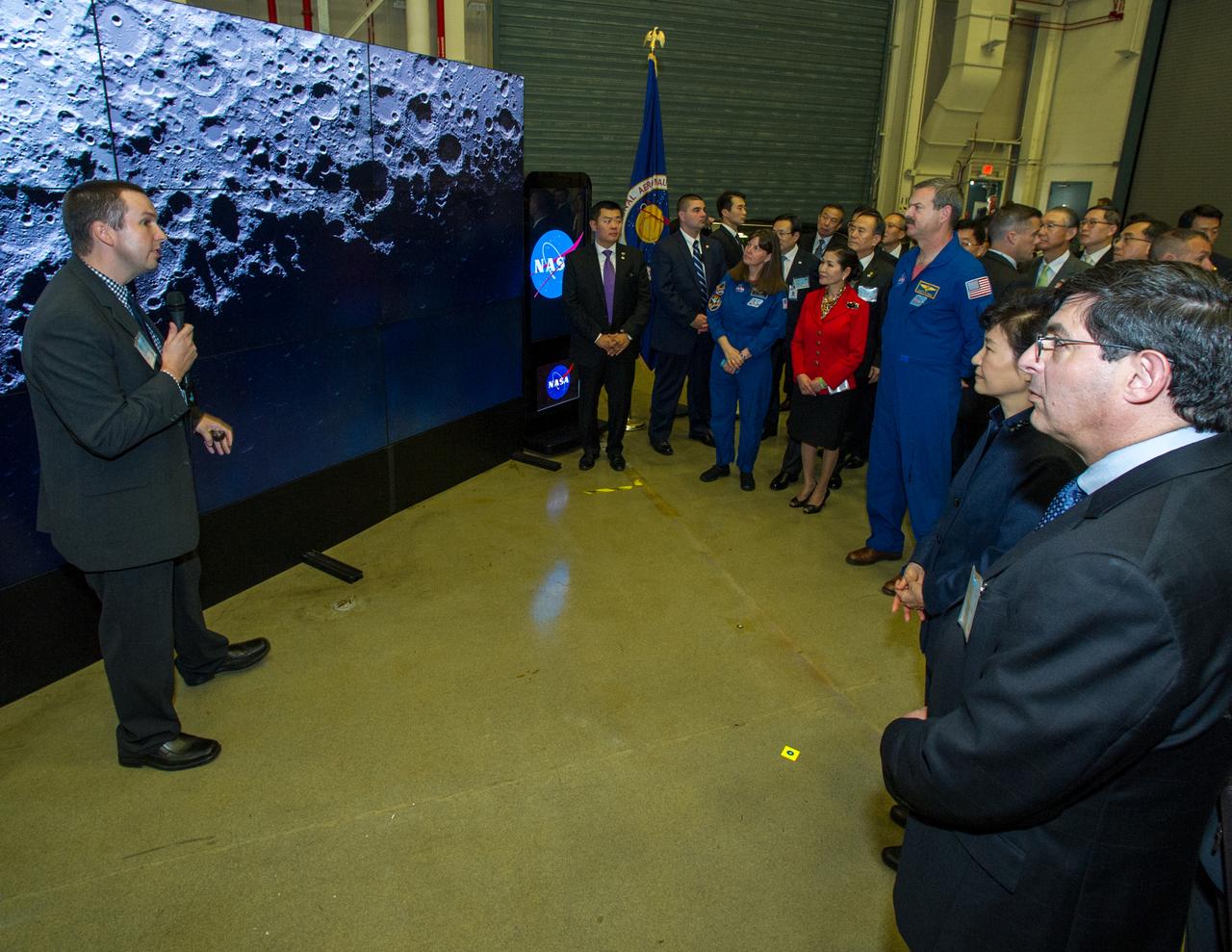Dr. Noah Petro, Deputy Project Scientist for the Lunar Reconnaissance Orbiter present space exploration findings on a mobile hyperwall display to President Park Geun-hye of South Korea. Madam Park’s visit to Goddard offered an opportunity to celebrate past collaborative efforts between the American and South Korean space programs along with presentations on current projects and programs underway at Goddard. Credit: NASA/Goddard/Bill Hrybyk <b><a href="http://www.nasa.gov/audience/formedia/features/MP_Photo_Guidelines.html" rel="nofollow">NASA image use policy.</a></b> <b><a href="http://www.nasa.gov/centers/goddard/home/index.html" rel="nofollow">NASA Goddard Space Flight Center</a></b> enables NASA’s mission through four scientific endeavors: Earth Science, Heliophysics, Solar System Exploration, and Astrophysics. Goddard plays a leading role in NASA’s accomplishments by contributing compelling scientific knowledge to advance the Agency’s mission. <b>Follow us on <a href="http://twitter.com/NASAGoddardPix" rel="nofollow">Twitter</a></b> <b>Like us on <a href="http://www.facebook.com/pages/Greenbelt-MD/NASA-Goddard/395013845897?ref=tsd" rel="nofollow">Facebook</a></b> <b>Find us on <a href="http://instagrid.me/nasagoddard/?vm=grid" rel="nofollow">Instagram</a></b>