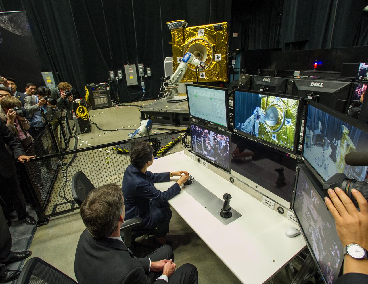 President Park Geun-hye of South Korea operates a robotic arm as Brian Roberts, Robotic Operations Manager at NASA Goddard describes the operations that take place in the Satellite Servicing Capabilities Office’s robotic lab.  As part of her visit to the United States, President Park Geun-hye of South Korea visited NASA’s Goddard Space Flight Center in Greenbelt, Md. On Oct. 14, 2015. The visit offered an opportunity to celebrate past collaborative efforts between the American and South Korean space programs along with presentations on current projects and programs underway at Goddard.  Credit: NASA/Goddard/Bill Hrybyk  <b><a href="http://www.nasa.gov/audience/formedia/features/MP_Photo_Guidelines.html" rel="nofollow">NASA image use policy.</a></b>  <b><a href="http://www.nasa.gov/centers/goddard/home/index.html" rel="nofollow">NASA Goddard Space Flight Center</a></b> enables NASA’s mission through four scientific endeavors: Earth Science, Heliophysics, Solar System Exploration, and Astrophysics. Goddard plays a leading role in NASA’s accomplishments by contributing compelling scientific knowledge to advance the Agency’s mission.  <b>Follow us on <a href="http://twitter.com/NASAGoddardPix" rel="nofollow">Twitter</a></b>  <b>Like us on <a href="http://www.facebook.com/pages/Greenbelt-MD/NASA-Goddard/395013845897?ref=tsd" rel="nofollow">Facebook</a></b>  <b>Find us on <a href="http://instagrid.me/nasagoddard/?vm=grid" rel="nofollow">Instagram</a></b>   