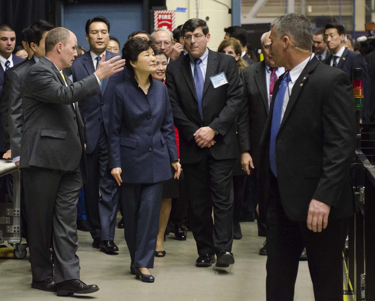 Caption: President Park Geun-hye of South Korea and Center Director Christopher Scolese are greeted by Frank Cepollina, Associate Director of the Satellite Servicing Capabilities Office, and Benjamin Reed, Deputy Project Manager of the Satellite Servicing Capabilities Office.  GODDARD VISIT BY SOUTH KOREAN PRESIDENT – 14-OCT-2015 As part of her visit to the United States, President Park Geun-hye of South Korea visited NASA’s Goddard Space Flight Center in Greenbelt, Md. On Oct. 14, 2015. The visit offered an opportunity to celebrate past collaborative efforts between the American and South Korean space programs along with presentations on current projects and programs underway at Goddard.  Credit: NASA/Goddard/Rebecca Roth  <b><a href="http://www.nasa.gov/audience/formedia/features/MP_Photo_Guidelines.html" rel="nofollow">NASA image use policy.</a></b>  <b><a href="http://www.nasa.gov/centers/goddard/home/index.html" rel="nofollow">NASA Goddard Space Flight Center</a></b> enables NASA’s mission through four scientific endeavors: Earth Science, Heliophysics, Solar System Exploration, and Astrophysics. Goddard plays a leading role in NASA’s accomplishments by contributing compelling scientific knowledge to advance the Agency’s mission.  <b>Follow us on <a href="http://twitter.com/NASAGoddardPix" rel="nofollow">Twitter</a></b>  <b>Like us on <a href="http://www.facebook.com/pages/Greenbelt-MD/NASA-Goddard/395013845897?ref=tsd" rel="nofollow">Facebook</a></b>  <b>Find us on <a href="http://instagrid.me/nasagoddard/?vm=grid" rel="nofollow">Instagram</a></b>   