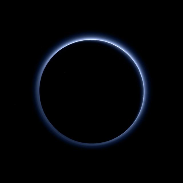 Pluto’s Blue Sky: Pluto’s haze layer shows its blue color in this picture taken by the New Horizons Ralph/Multispectral Visible Imaging Camera (MVIC). The high-altitude haze is thought to be similar in nature to that seen at Saturn’s moon Titan. The source of both hazes likely involves sunlight-initiated chemical reactions of nitrogen and methane, leading to relatively small, soot-like particles (called tholins) that grow as they settle toward the surface. This image was generated by software that combines information from blue, red and near-infrared images to replicate the color a human eye would perceive as closely as possible.  Credits: NASA/JHUAPL/SwRI  Read more: <a href="http://www.nasa.gov/nh/nh-finds-blue-skies-and-water-ice-on-pluto" rel="nofollow">www.nasa.gov/nh/nh-finds-blue-skies-and-water-ice-on-pluto</a>  <b><a href="http://www.nasa.gov/audience/formedia/features/MP_Photo_Guidelines.html" rel="nofollow">NASA image use policy.</a></b>  <b><a href="http://www.nasa.gov/centers/goddard/home/index.html" rel="nofollow">NASA Goddard Space Flight Center</a></b> enables NASA’s mission through four scientific endeavors: Earth Science, Heliophysics, Solar System Exploration, and Astrophysics. Goddard plays a leading role in NASA’s accomplishments by contributing compelling scientific knowledge to advance the Agency’s mission.  <b>Follow us on <a href="http://twitter.com/NASAGoddardPix" rel="nofollow">Twitter</a></b>  <b>Like us on <a href="http://www.facebook.com/pages/Greenbelt-MD/NASA-Goddard/395013845897?ref=tsd" rel="nofollow">Facebook</a></b>  <b>Find us on <a href="http://instagrid.me/nasagoddard/?vm=grid" rel="nofollow">Instagram</a></b>  