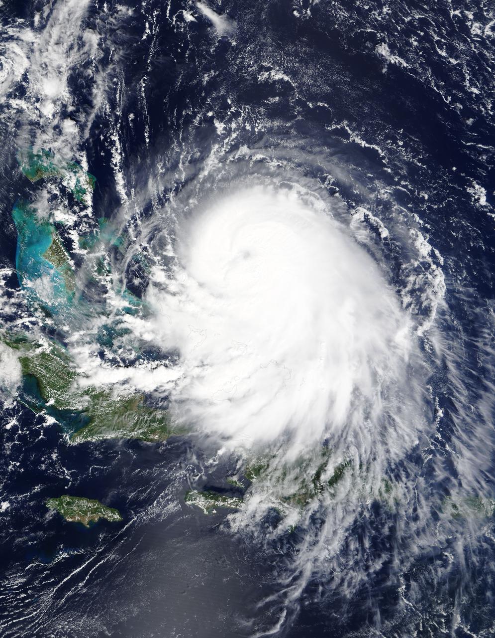 The MODIS instrument on NASA's Terra satellite captured Hurricane Joaquin off the Bahamas at 15:45 UTC (11:45 a.m. EDT) on September 30, 2015.  Credit: NASA/GSFC/Jeff Schmaltz/MODIS Land Rapid Response Team  At 11 a.m. EDT (1500 UTC) on Wednesday, September 30, 2015 the center of Hurricane Joaquin was located near latitude 24.7 North, longitude 72.6 West. That puts the center of Joaquin about 215 miles (345 km) east-northeast of the Central Bahamas.    Joaquin became a tropical storm Monday evening (EDT), September 29 when it was midway between the Bahamas and Bermuda. By 8 a.m. EDT on September 30, it strengthened into a hurricane and has become the third hurricane of the Atlantic Hurricane season.  On September 30, the National Hurricane Center issued a Hurricane Warning for the central Bahamas including Cat Island, the Exumas, Long Island, Rum Cay, and San Salvador. A Hurricane Watch is in effect for the northwestern Bahamas including the Abacos, Berry Islands, Bimini, Eleuthera, Grand Bahama Island, and New Providence, but excluding Andros Island.   <b><a href="http://www.nasa.gov/audience/formedia/features/MP_Photo_Guidelines.html" rel="nofollow">NASA image use policy.</a></b>  <b><a href="http://www.nasa.gov/centers/goddard/home/index.html" rel="nofollow">NASA Goddard Space Flight Center</a></b> enables NASA’s mission through four scientific endeavors: Earth Science, Heliophysics, Solar System Exploration, and Astrophysics. Goddard plays a leading role in NASA’s accomplishments by contributing compelling scientific knowledge to advance the Agency’s mission.  <b>Follow us on <a href="http://twitter.com/NASAGoddardPix" rel="nofollow">Twitter</a></b>  <b>Like us on <a href="http://www.facebook.com/pages/Greenbelt-MD/NASA-Goddard/395013845897?ref=tsd" rel="nofollow">Facebook</a></b>  <b>Find us on <a href="http://instagrid.me/nasagoddard/?vm=grid" rel="nofollow">Instagram</a></b>