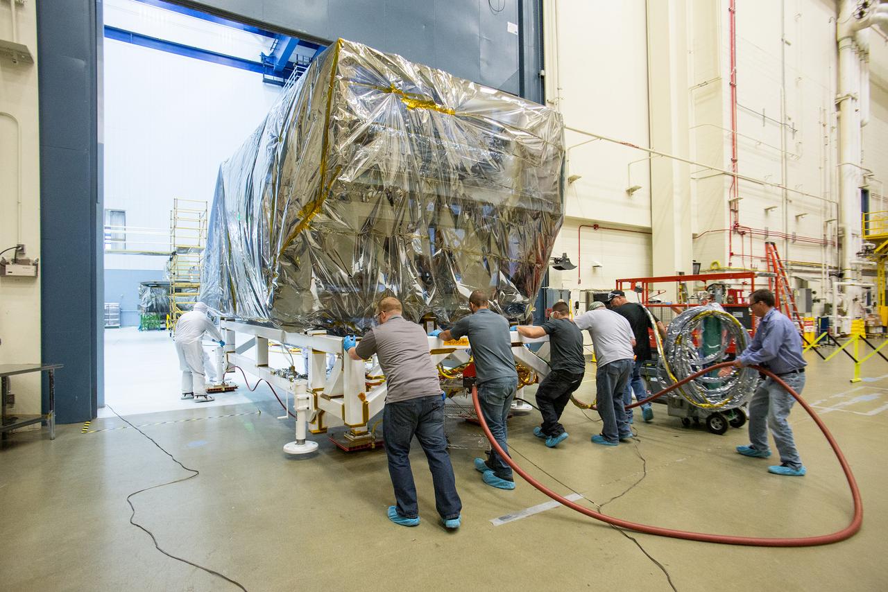The wrapped up ISIM structure pushed back to the clean room post acoustics-test, to prepare for the EMI test. Credits: NASA/Desiree Stover    Read more: <a href="http://1.usa.gov/1KvoY4p" rel="nofollow">1.usa.gov/1KvoY4p</a>  <b><a href="http://www.nasa.gov/audience/formedia/features/MP_Photo_Guidelines.html" rel="nofollow">NASA image use policy.</a></b>  <b><a href="http://www.nasa.gov/centers/goddard/home/index.html" rel="nofollow">NASA Goddard Space Flight Center</a></b> enables NASA’s mission through four scientific endeavors: Earth Science, Heliophysics, Solar System Exploration, and Astrophysics. Goddard plays a leading role in NASA’s accomplishments by contributing compelling scientific knowledge to advance the Agency’s mission.  <b>Follow us on <a href="http://twitter.com/NASAGoddardPix" rel="nofollow">Twitter</a></b>  <b>Like us on <a href="http://www.facebook.com/pages/Greenbelt-MD/NASA-Goddard/395013845897?ref=tsd" rel="nofollow">Facebook</a></b>  <b>Find us on <a href="http://instagrid.me/nasagoddard/?vm=grid" rel="nofollow">Instagram</a></b>