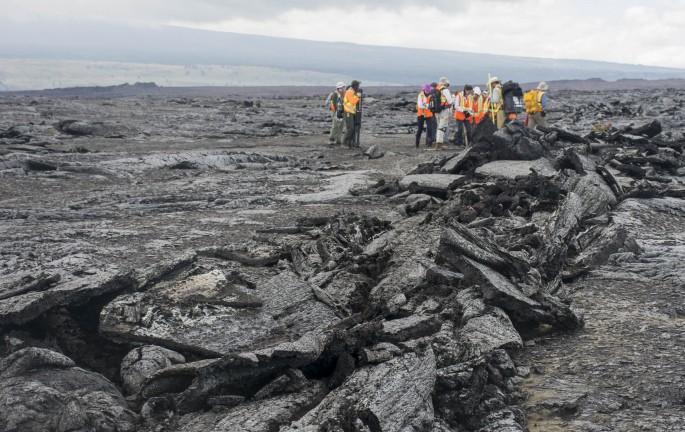 March across pahoehoe  The team hikes across Kilauea’s lava fields to reach designated test sites. Several types of lava make up the fields, primarily smooth pahoehoe, which can harden into a ropy, shelly or slabby (pictured here) texture. Some of the most dangerous lava to walk on is a’a – unstable piles of jagged rock. Credit: NASA/GSFC/Jasmine Blennau   In June, five student journalists from Stony Brook University  packed their hiking boots and hydration packs and joined a NASA-funded science team for 10 days on the lava fields of Kilauea, an active Hawaiian volcano. Kilauea’s lava fields are an ideal place to test equipment designed for use on Earth’s moon or Mars, because volcanic activity shaped so much of those terrains. The trip was part of an interdisciplinary program called RIS4E – short for Remote, In Situ, and Synchrotron Studies for Science and Exploration – which is designed to prepare for future exploration of the moon, near-Earth asteroids and the moons of Mars.   To read reports from the RIS4E journalism students about their experiences in Hawaii, visit <a href="http://ReportingRIS4E.com" rel="nofollow">ReportingRIS4E.com</a>  <b><a href="http://www.nasa.gov/audience/formedia/features/MP_Photo_Guidelines.html" rel="nofollow">NASA image use policy.</a></b>  <b><a href="http://www.nasa.gov/centers/goddard/home/index.html" rel="nofollow">NASA Goddard Space Flight Center</a></b> enables NASA’s mission through four scientific endeavors: Earth Science, Heliophysics, Solar System Exploration, and Astrophysics. Goddard plays a leading role in NASA’s accomplishments by contributing compelling scientific knowledge to advance the Agency’s mission.  <b>Follow us on <a href="http://twitter.com/NASAGoddardPix" rel="nofollow">Twitter</a></b>  <b>Like us on <a href="http://www.facebook.com/pages/Greenbelt-MD/NASA-Goddard/395013845897?ref=tsd" rel="nofollow">Facebook</a></b>  <b>Find us on <a href="http://instagrid.me/nasagoddard/?vm=grid" rel="nofollow">Instagram</a></b> 