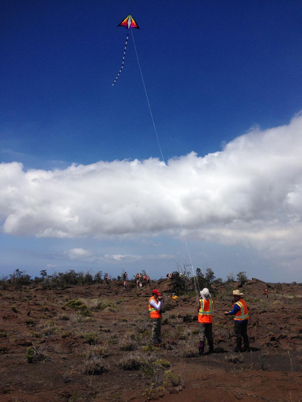 Team kite  This kite was part of the scientific tool kit. It carried a camera that can be used to make high-resolution mosaics of the study site. Credit: NASA/GSFC/Jacob Bleacher   In June, five student journalists from Stony Brook University  packed their hiking boots and hydration packs and joined a NASA-funded science team for 10 days on the lava fields of Kilauea, an active Hawaiian volcano. Kilauea’s lava fields are an ideal place to test equipment designed for use on Earth’s moon or Mars, because volcanic activity shaped so much of those terrains. The trip was part of an interdisciplinary program called RIS4E – short for Remote, In Situ, and Synchrotron Studies for Science and Exploration – which is designed to prepare for future exploration of the moon, near-Earth asteroids and the moons of Mars.   To read reports from the RIS4E journalism students about their experiences in Hawaii, visit <a href="http://ReportingRIS4E.com" rel="nofollow">ReportingRIS4E.com</a>  <b><a href="http://www.nasa.gov/audience/formedia/features/MP_Photo_Guidelines.html" rel="nofollow">NASA image use policy.</a></b>  <b><a href="http://www.nasa.gov/centers/goddard/home/index.html" rel="nofollow">NASA Goddard Space Flight Center</a></b> enables NASA’s mission through four scientific endeavors: Earth Science, Heliophysics, Solar System Exploration, and Astrophysics. Goddard plays a leading role in NASA’s accomplishments by contributing compelling scientific knowledge to advance the Agency’s mission.  <b>Follow us on <a href="http://twitter.com/NASAGoddardPix" rel="nofollow">Twitter</a></b>  <b>Like us on <a href="http://www.facebook.com/pages/Greenbelt-MD/NASA-Goddard/395013845897?ref=tsd" rel="nofollow">Facebook</a></b>  <b>Find us on <a href="http://instagrid.me/nasagoddard/?vm=grid" rel="nofollow">Instagram</a></b> 
