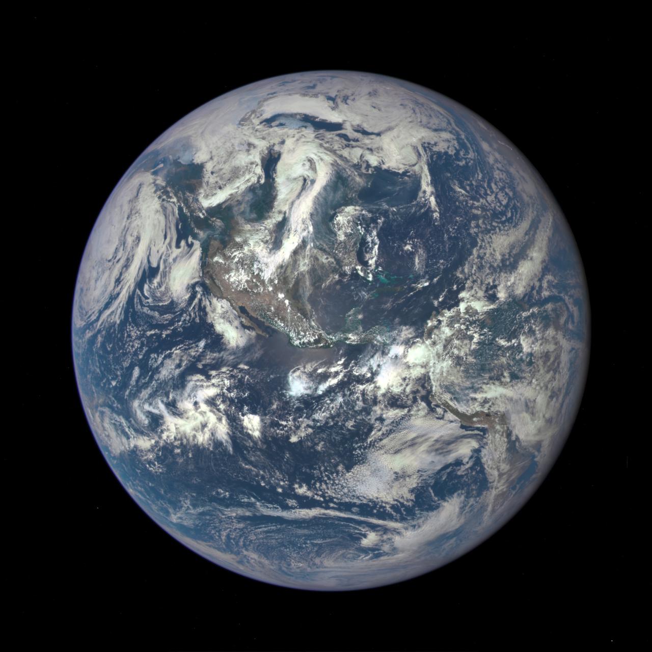 A NASA camera on the Deep Space Climate Observatory satellite has returned its first view of the entire sunlit side of Earth from one million miles away. This color image of Earth was taken by NASA’s Earth Polychromatic Imaging Camera (EPIC), a four megapixel CCD camera and telescope. The image was generated by combining three separate images to create a photographic-quality image. The camera takes a series of 10 images using different narrowband filters -- from ultraviolet to near infrared -- to produce a variety of science products. The red, green and blue channel images are used in these color images. The image was taken July 6, 2015, showing North and Central America. The central turquoise areas are shallow seas around the Caribbean islands. This Earth image shows the effects of sunlight scattered by air molecules, giving the image a characteristic bluish tint. The EPIC team is working to remove this atmospheric effect from subsequent images. Once the instrument begins regular data acquisition, EPIC will provide a daily series of Earth images allowing for the first time study of daily variations over the entire globe. These images, available 12 to 36 hours after they are acquired, will be posted to a dedicated web page by September 2015. The primary objective of DSCOVR, a partnership between NASA, the National Oceanic and Atmospheric Administration (NOAA) and the U.S. Air Force, is to maintain the nation’s real-time solar wind monitoring capabilities, which are critical to the accuracy and lead time of space weather alerts and forecasts from NOAA. For more information about DSCOVR, visit: <a href="http://www.nesdis.noaa.gov/DSCOVR/" rel="nofollow">www.nesdis.noaa.gov/DSCOVR/</a>