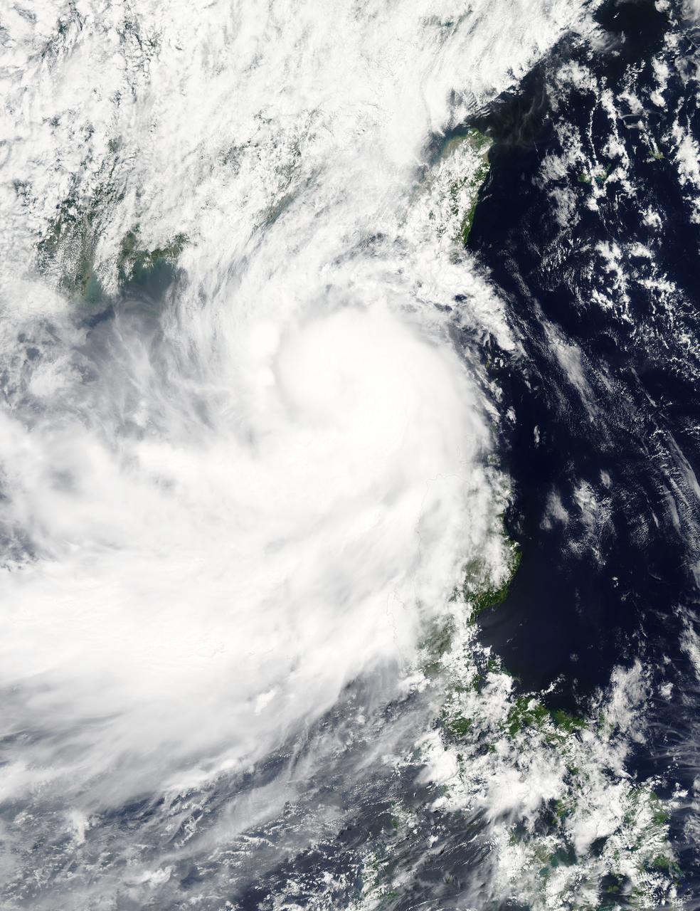 NASA's Aqua satellite captured a picture of Tropical Storm Linfa in the South China Sea on July 7 when it was between southern Taiwan and the northern Philippines. Aqua passed over Linfa on July 7 at 05:25 UTC (1:25 a.m. EDT) and the Moderate Resolution Imaging Spectroradiometer or MODIS instrument captured a visible image of the storm. Bands of thunderstorms wrapping into the center of circulation from the south, draped over western Luzon. The MODIS image showed the tight concentration of thunderstorms around Linfa's center were located over the South China Sea. Fragmented bands of thunderstorms north of the center were brushing over Southern Taiwan while clouds from another band of fragmented thunderstorms stretched northwest through the Taiwan Strait. On July 7 at 1500 UTC (11 a.m. EDT), Tropical Storm Linfa's maximum sustained winds had increased to 50 knots (57.5 mph/92.6 kph), up from 45 knots (51.7 mph/83.3 kph) six hours before. Linfa strengthened in the warm waters of the South China Sea now that its center has moved away from the northern Philippines and was no longer over land. Linfa was centered near 21.0 North latitude and 118.8 East longitude, about 277 nautical miles (319 miles/513.3 km) east-southeast of Hong Kong, China. Linfa has tracked northward at 3 knots (3.5 mph/5.5 kph). China's National Meteorological Centre has (CNMC) issued a yellow category warning of typhoon at 6:00 a.m. July 7, Beijing Time. CNMC noted that Linfa is the tenth typhoon this year and at that time it was centered about 430 km (267.2 miles) southeast of border between Fujian and Guangdong For updated warnings and watches from the China Meteorological Service, visit: <a href="http://www.cma.gov.cn/en/WeatherWarnings/" rel="nofollow">www.cma.gov.cn/en/WeatherWarnings/</a>. Linfa is moving north between Luzon and Taiwan. The Joint Typhoon Warning Center expects Linfa to strengthen to 60 knots (69 mph/111 kph) by mid-day on July 9, before weakening and then making landfall in mainland China. Credit: NASA/GSFC/Jeff Schmaltz/MODIS Land Rapid Response Team <b><a href="http://www.nasa.gov/audience/formedia/features/MP_Photo_Guidelines.html" rel="nofollow">NASA image use policy.</a></b> <b><a href="http://www.nasa.gov/centers/goddard/home/index.html" rel="nofollow">NASA Goddard Space Flight Center</a></b> enables NASA’s mission through four scientific endeavors: Earth Science, Heliophysics, Solar System Exploration, and Astrophysics. Goddard plays a leading role in NASA’s accomplishments by contributing compelling scientific knowledge to advance the Agency’s mission. <b>Follow us on <a href="http://twitter.com/NASAGoddardPix" rel="nofollow">Twitter</a></b> <b>Like us on <a href="http://www.facebook.com/pages/Greenbelt-MD/NASA-Goddard/395013845897?ref=tsd" rel="nofollow">Facebook</a></b> <b>Find us on <a href="http://instagrid.me/nasagoddard/?vm=grid" rel="nofollow">Instagram</a></b>
